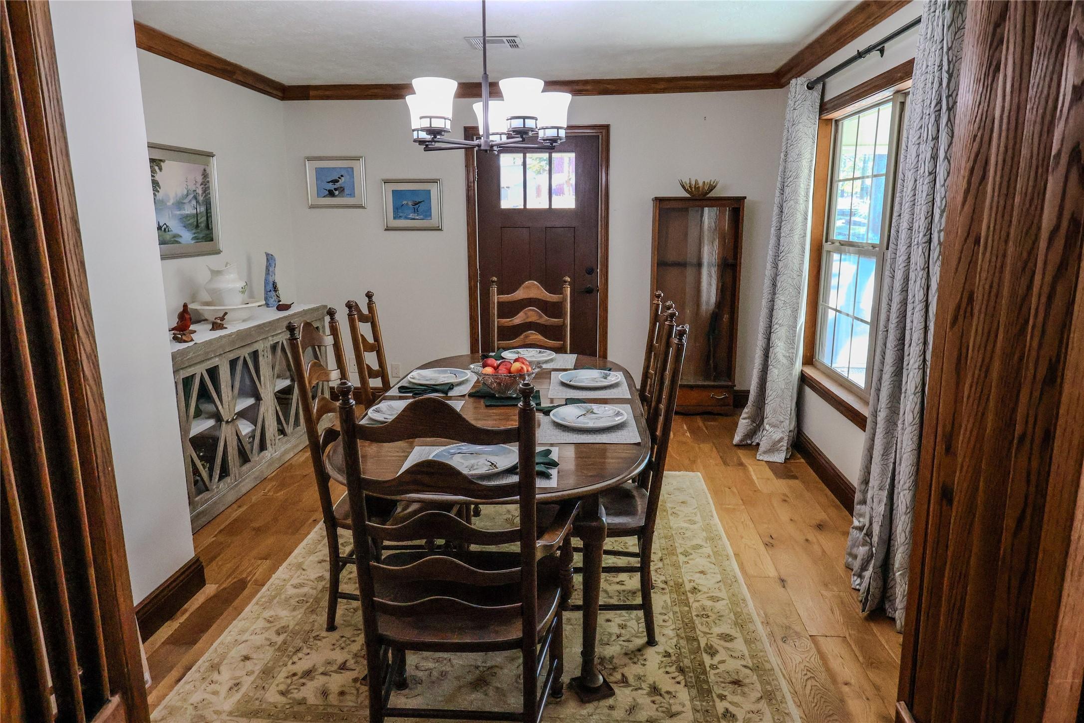 Image 2: Front door opens to the formal dining room.