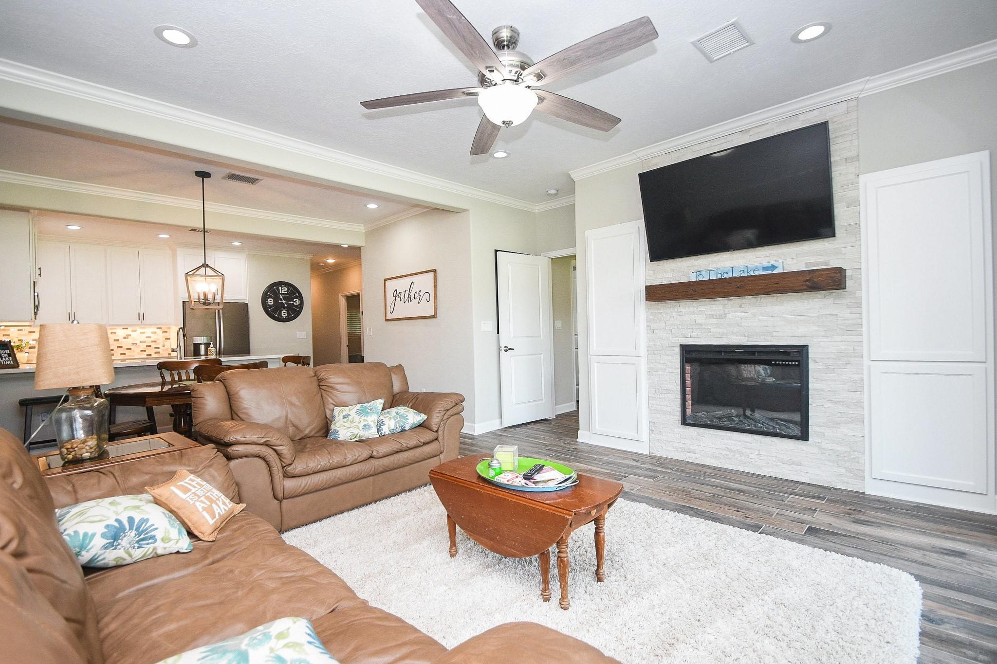 Image 4: Cozy gathering place with wood burning fireplace c