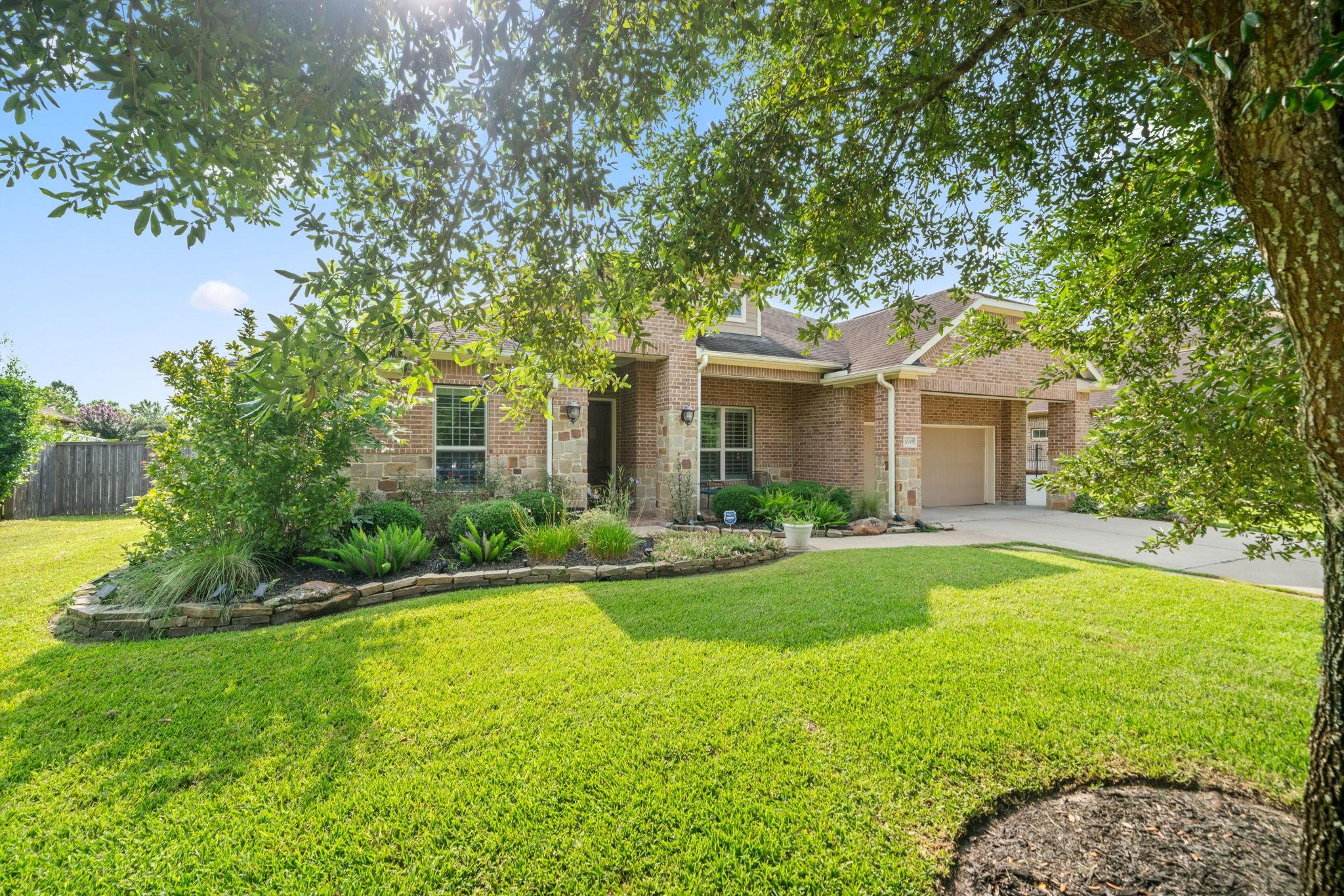 Image 2: Lush Greenery and a Manicured Lawn.