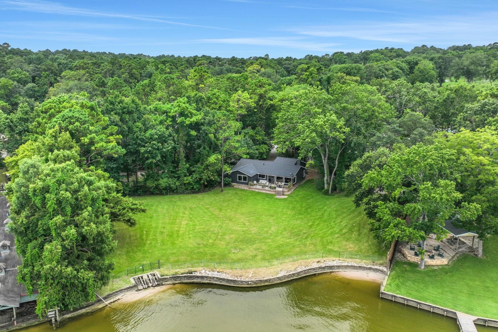 Image 2: This waterfront home is positioned on 1.175 acres!