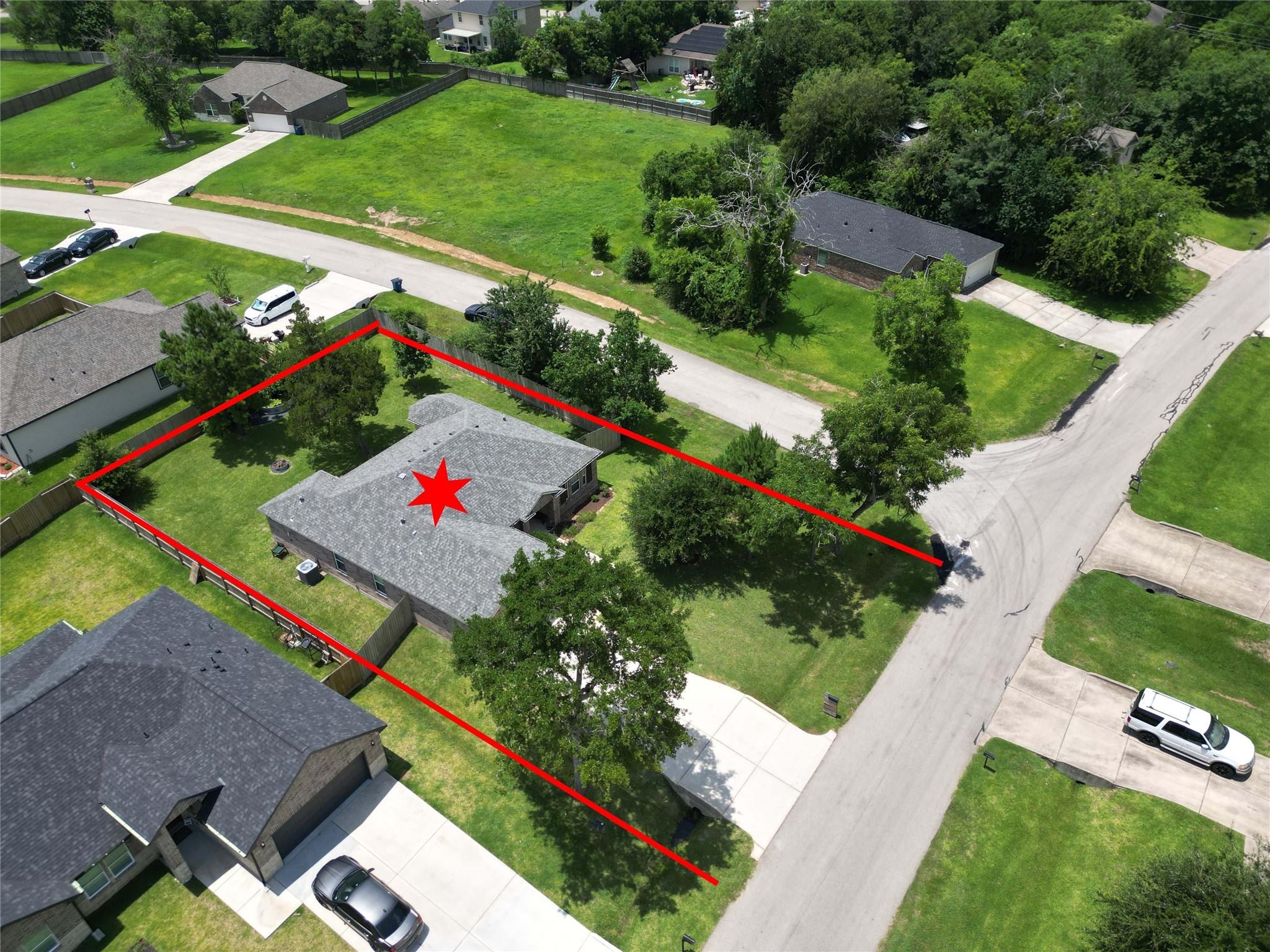 Image 3: This aerial photo highlights a single-story home o