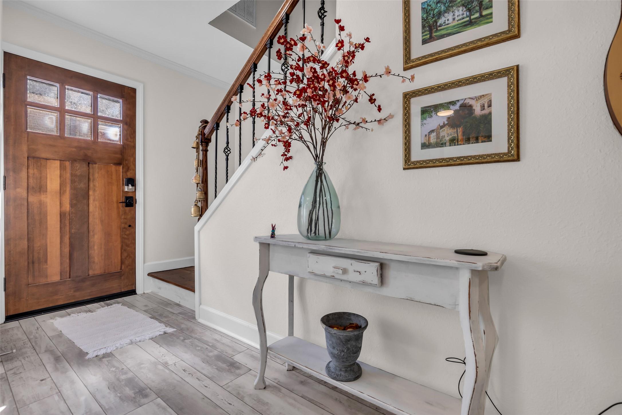 Image 2: The foyer provides a welcoming first impression, w
