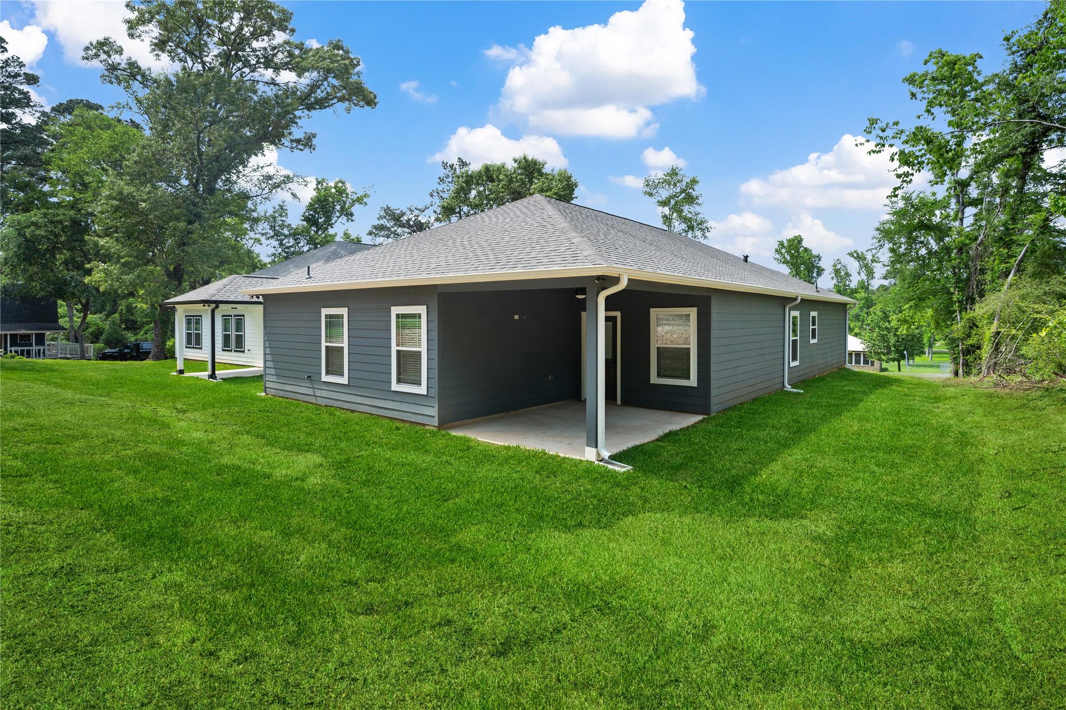 Image 3: Rear of home with 11 x 14 covered porch.