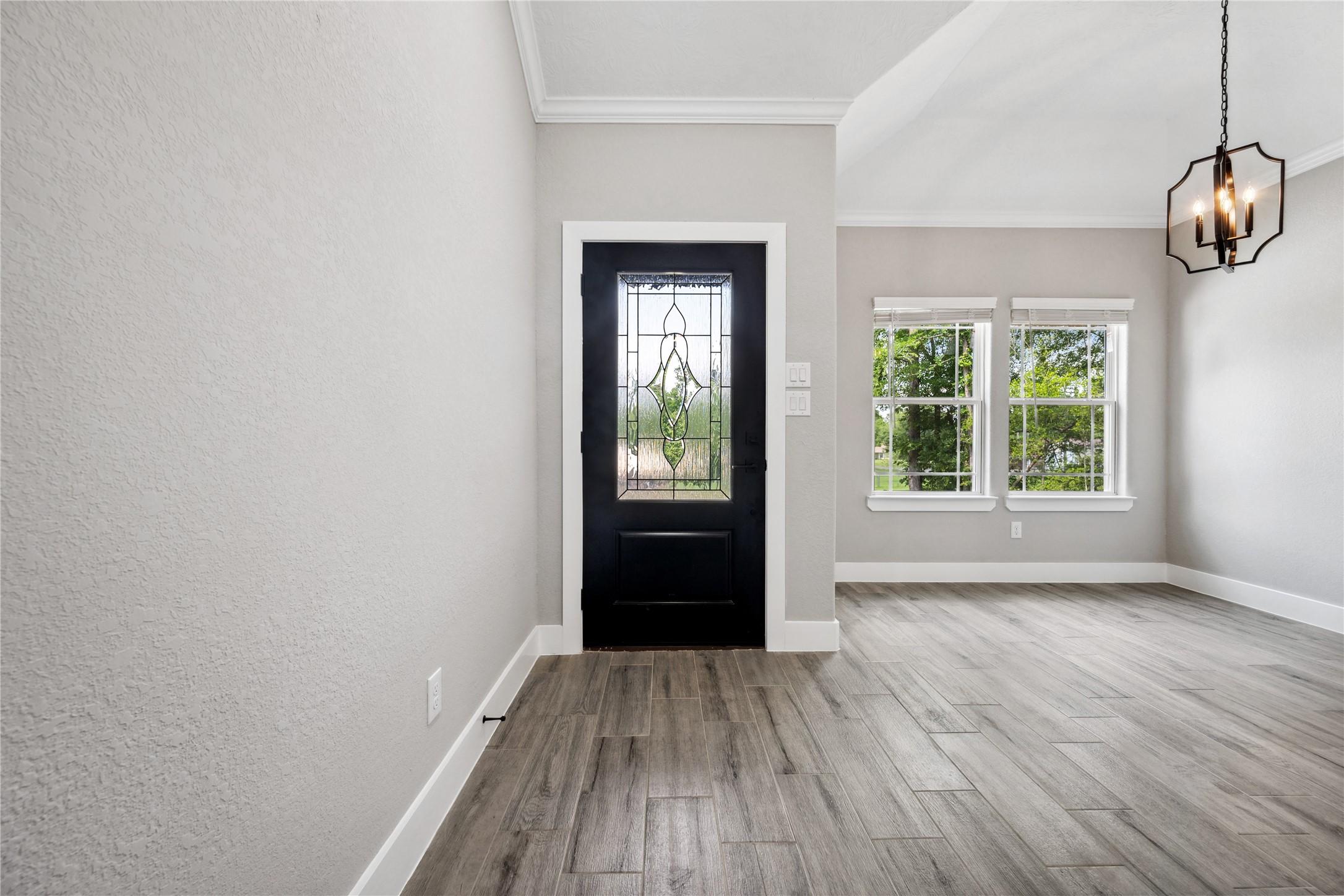 Image 4: Foyer opens to the dining room.
