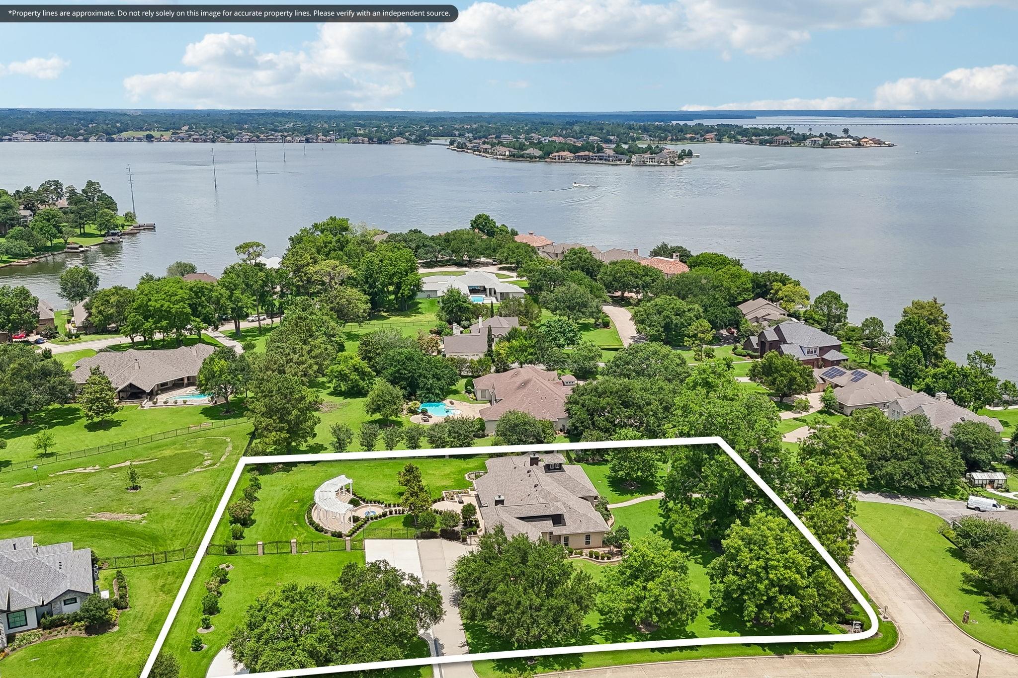 Image 2: This aerial photo showcases a spacious property wi