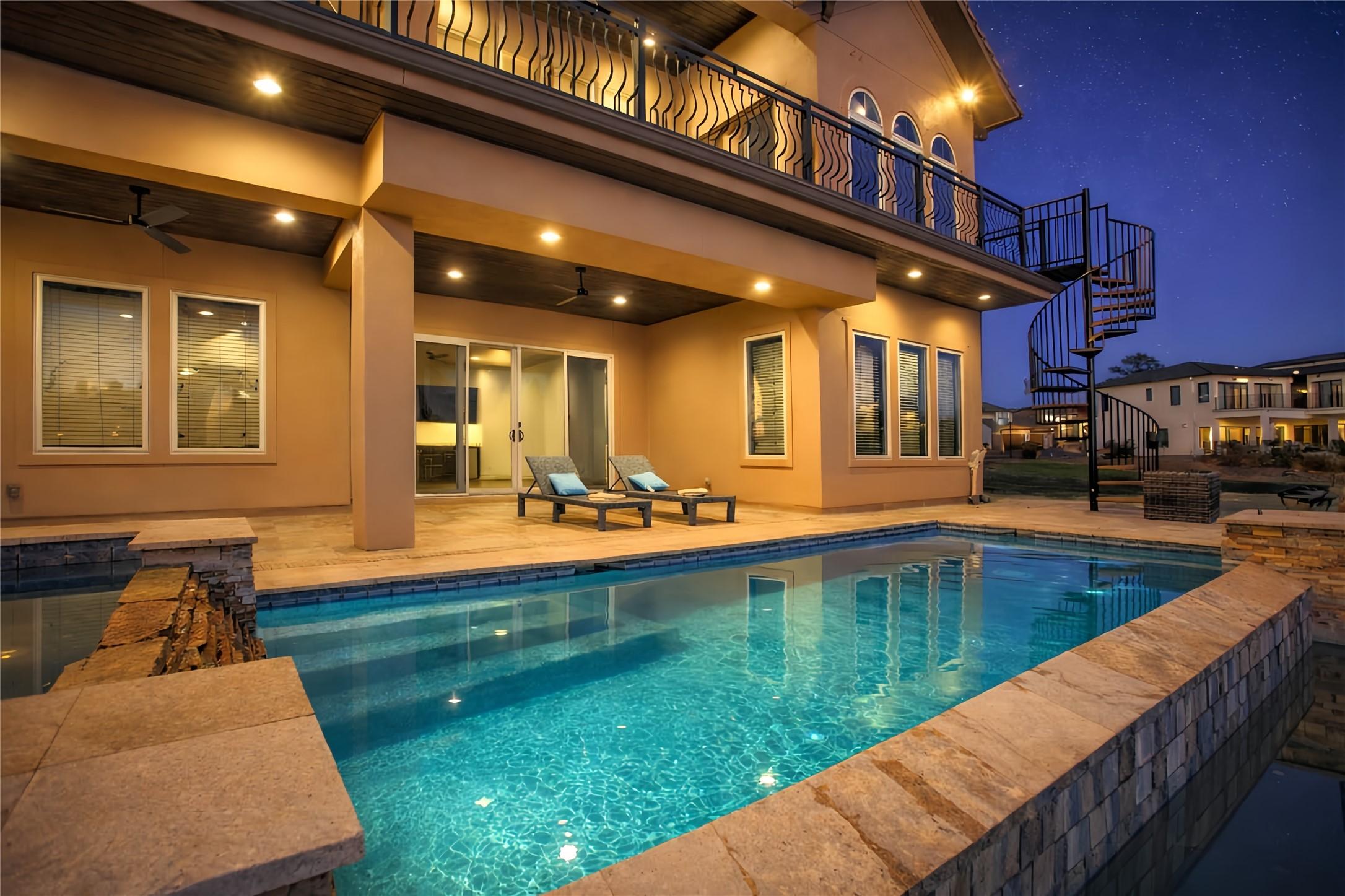 Image 3: Backyard features a luxurious outdoor area with a