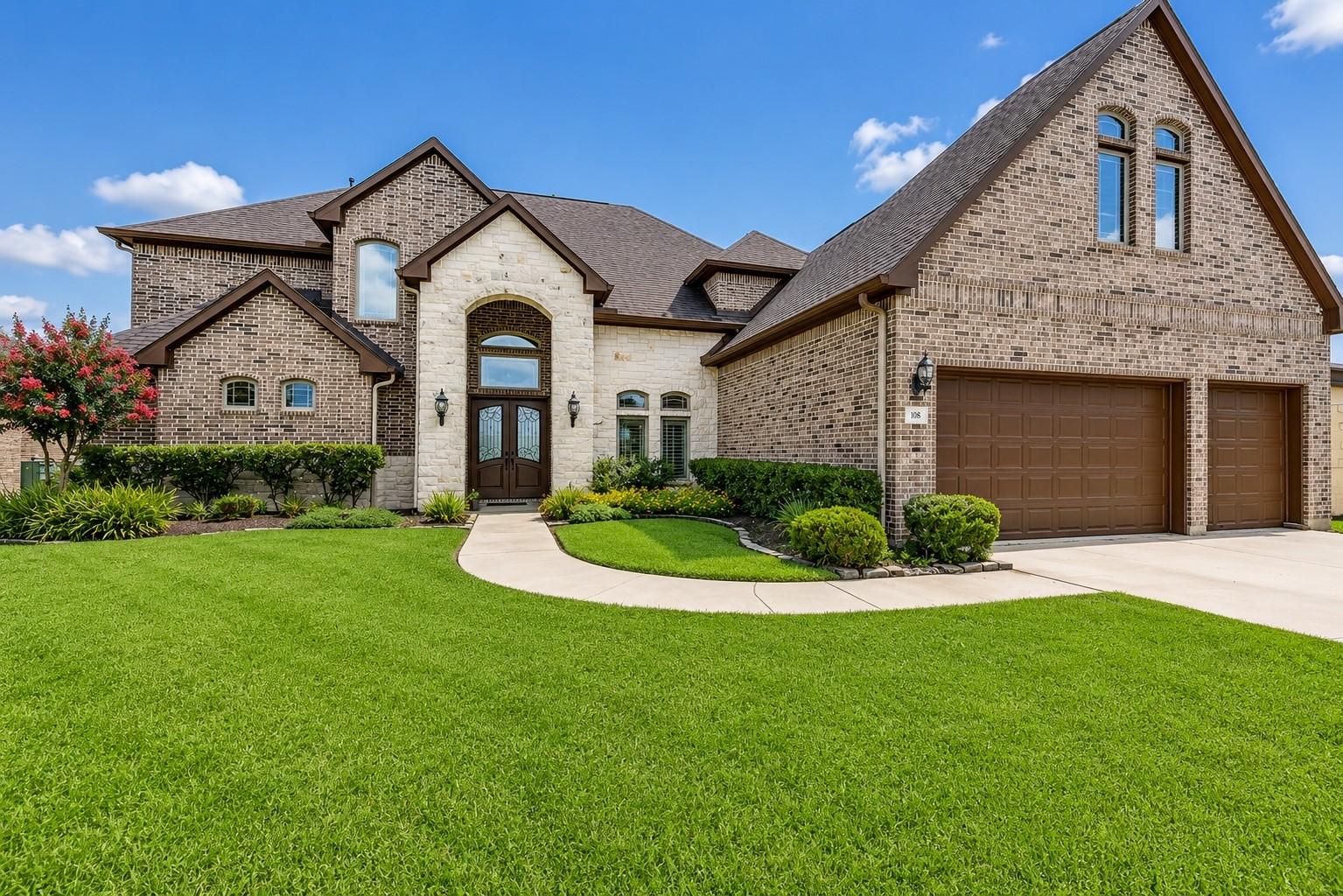 Image 3: Thoughtfully designed brick and stone exterior wit