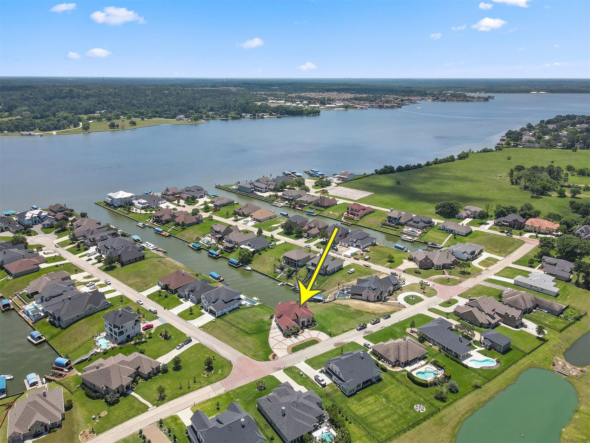 Image 2: This aerial view captures a highlighted home in a