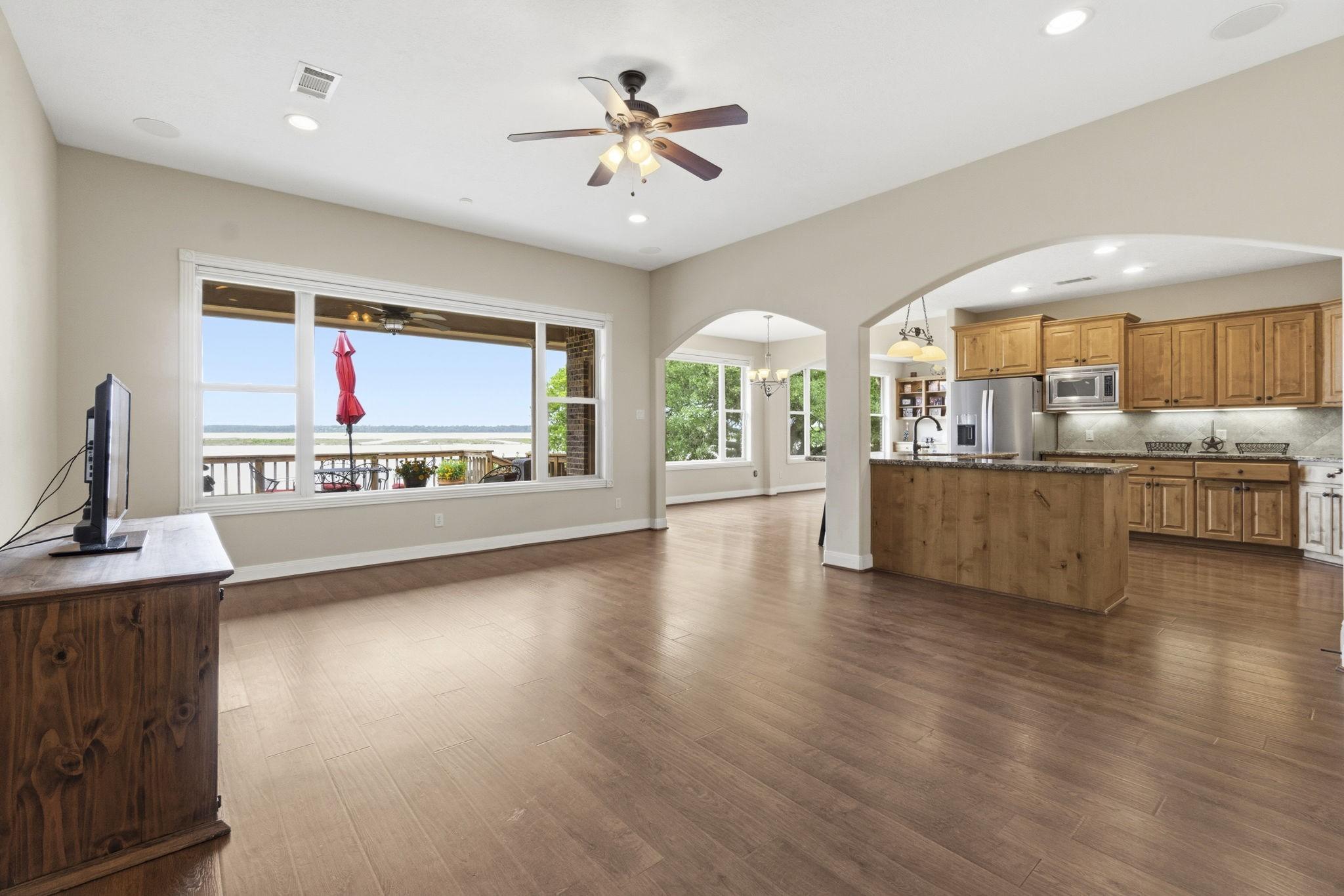 Image 4: Living dinging kitchen combo with lake views