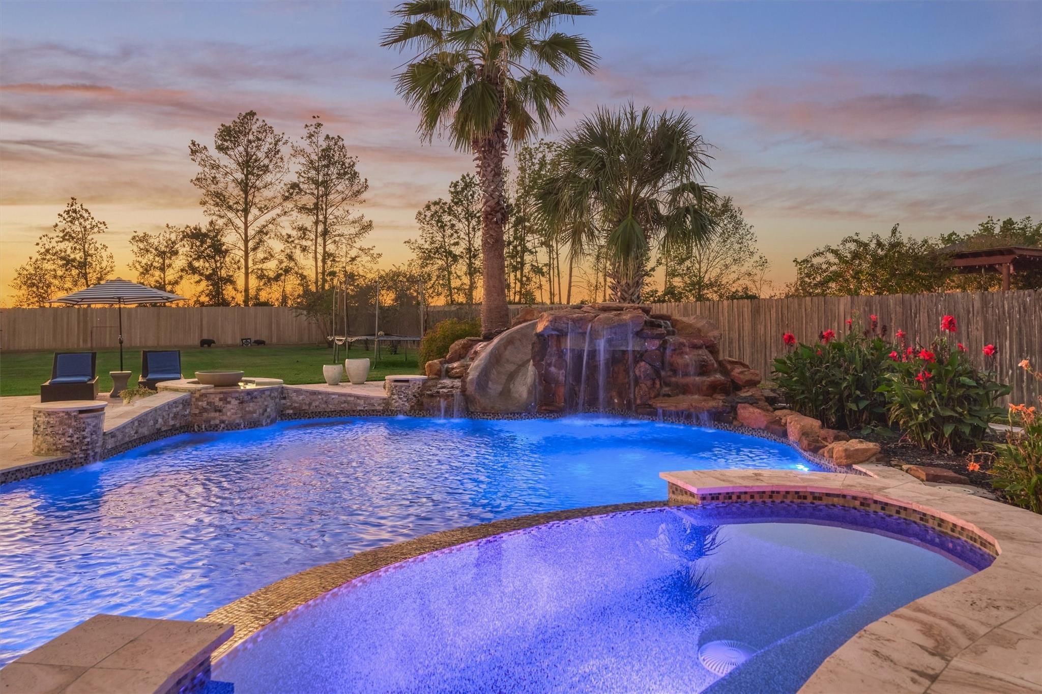 Image 2: This backyard offers incredible features designed