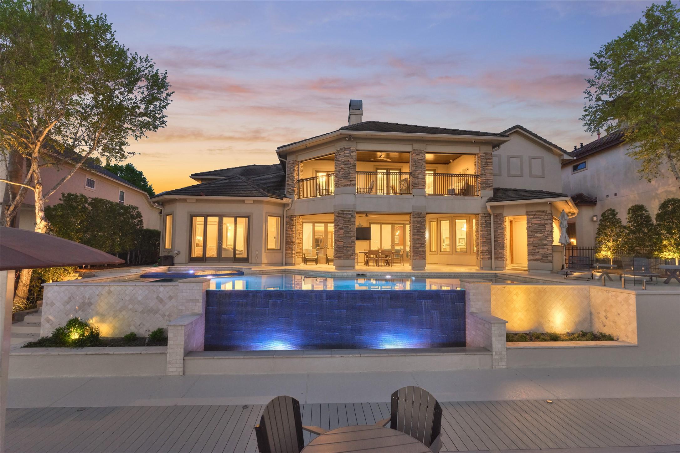 Image 2: Incredible backyard oasis, complete with a zero ed