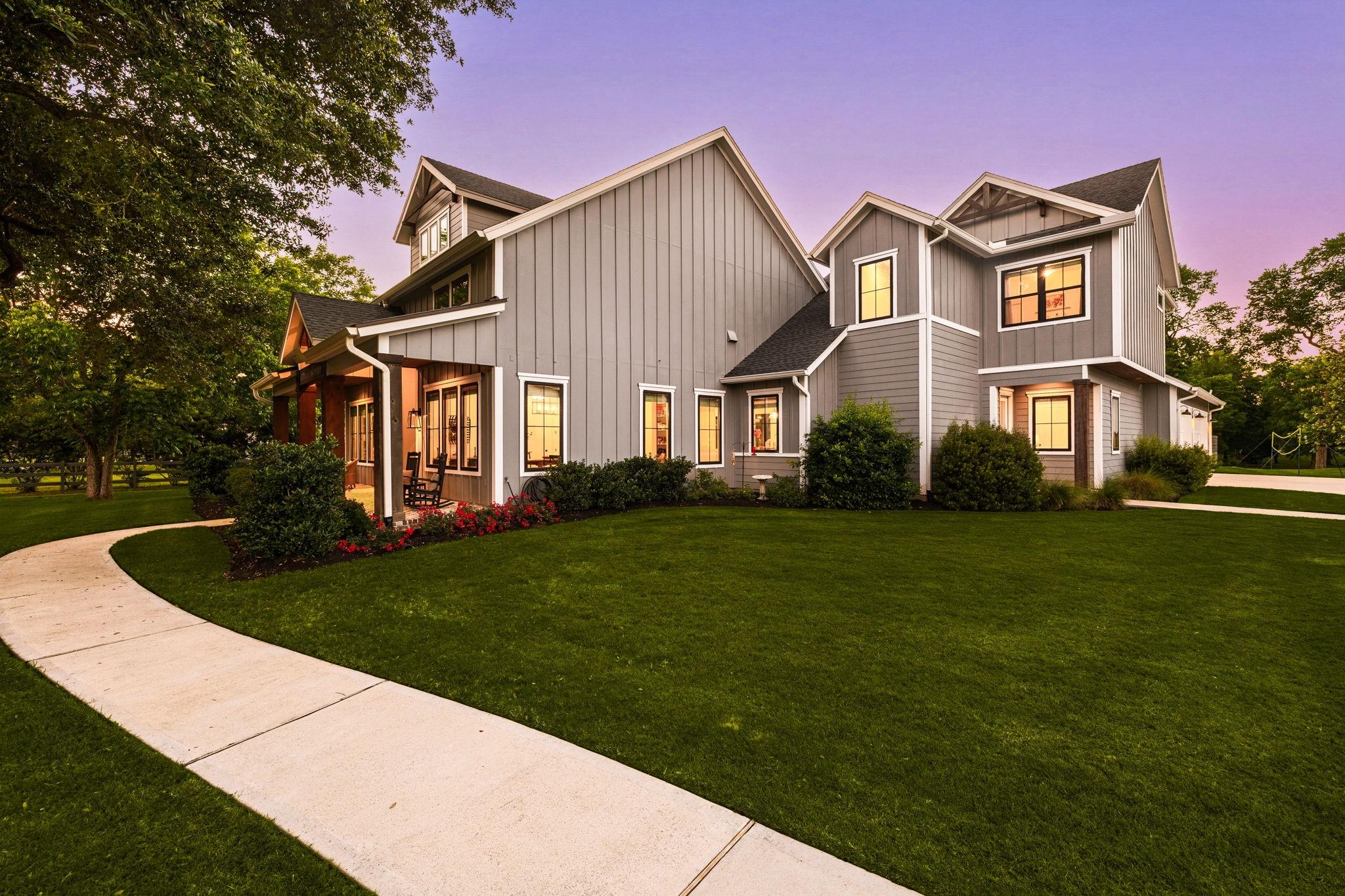 Image 2: Beautiful modern farmhouse with a welcoming front