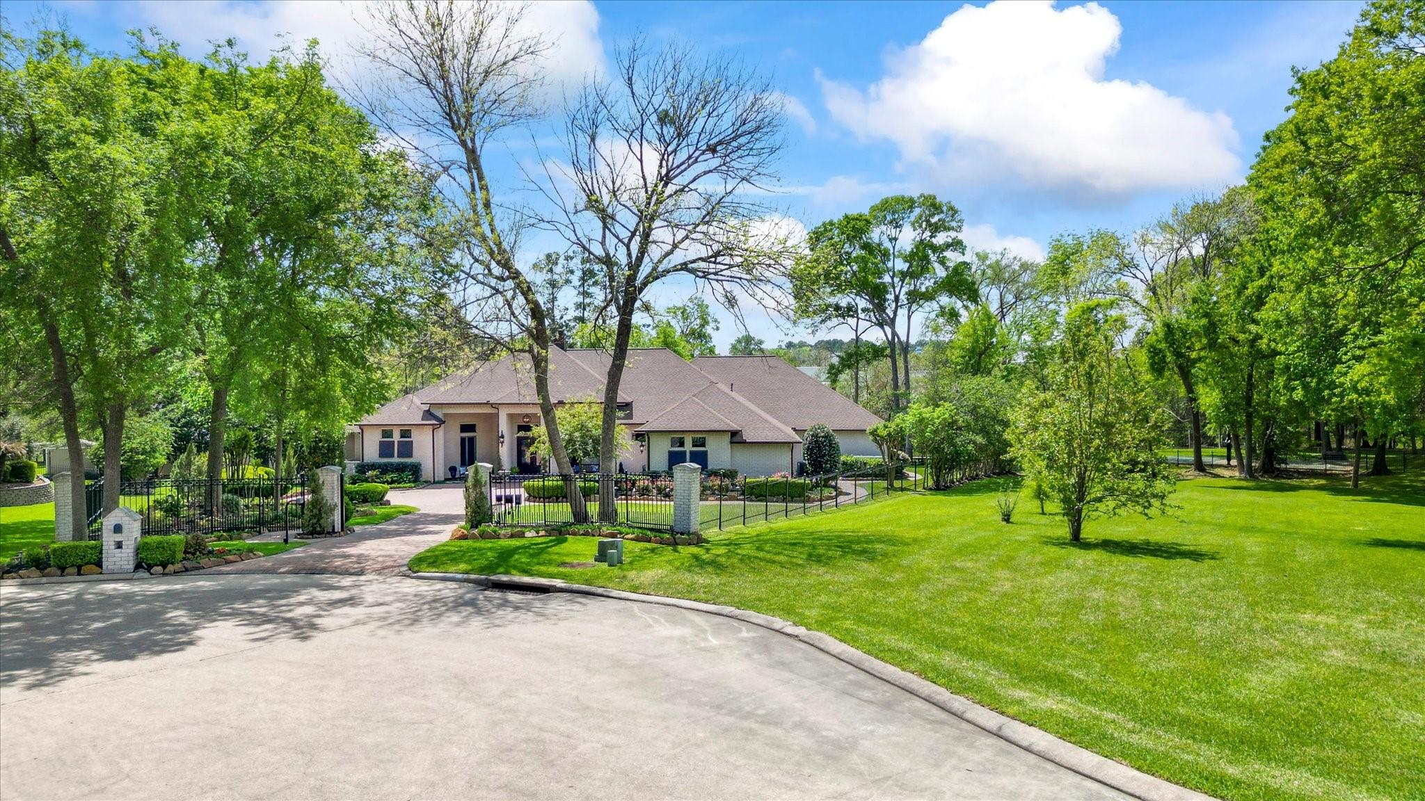 Image 4: A park-type setting surrounds the home.  Home in a