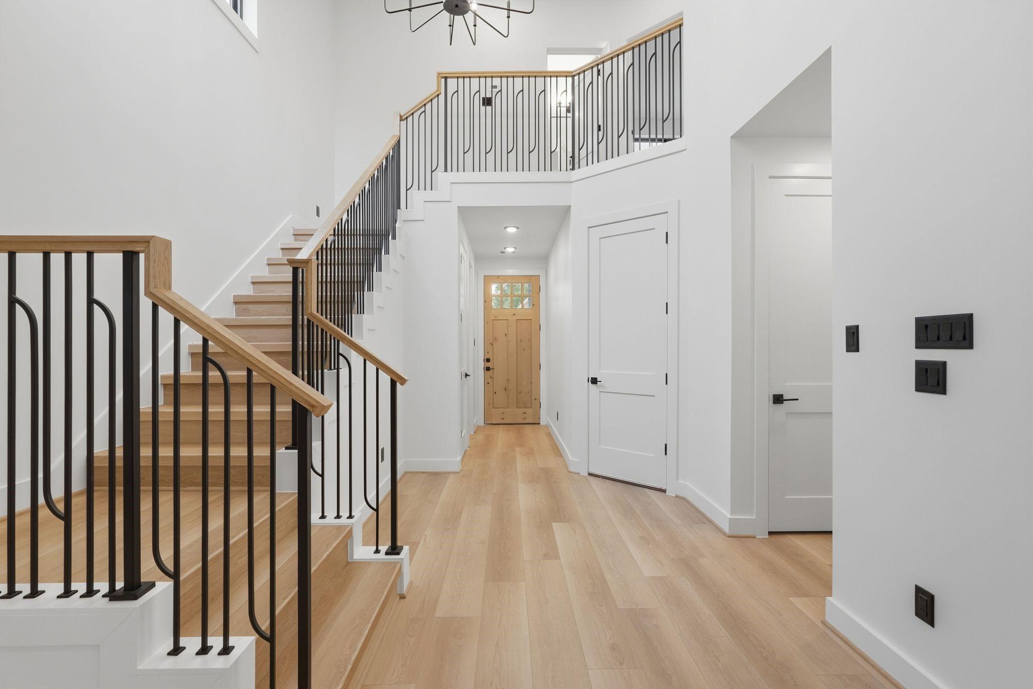 Image 4: A bright, open entry gives this home a clean moder