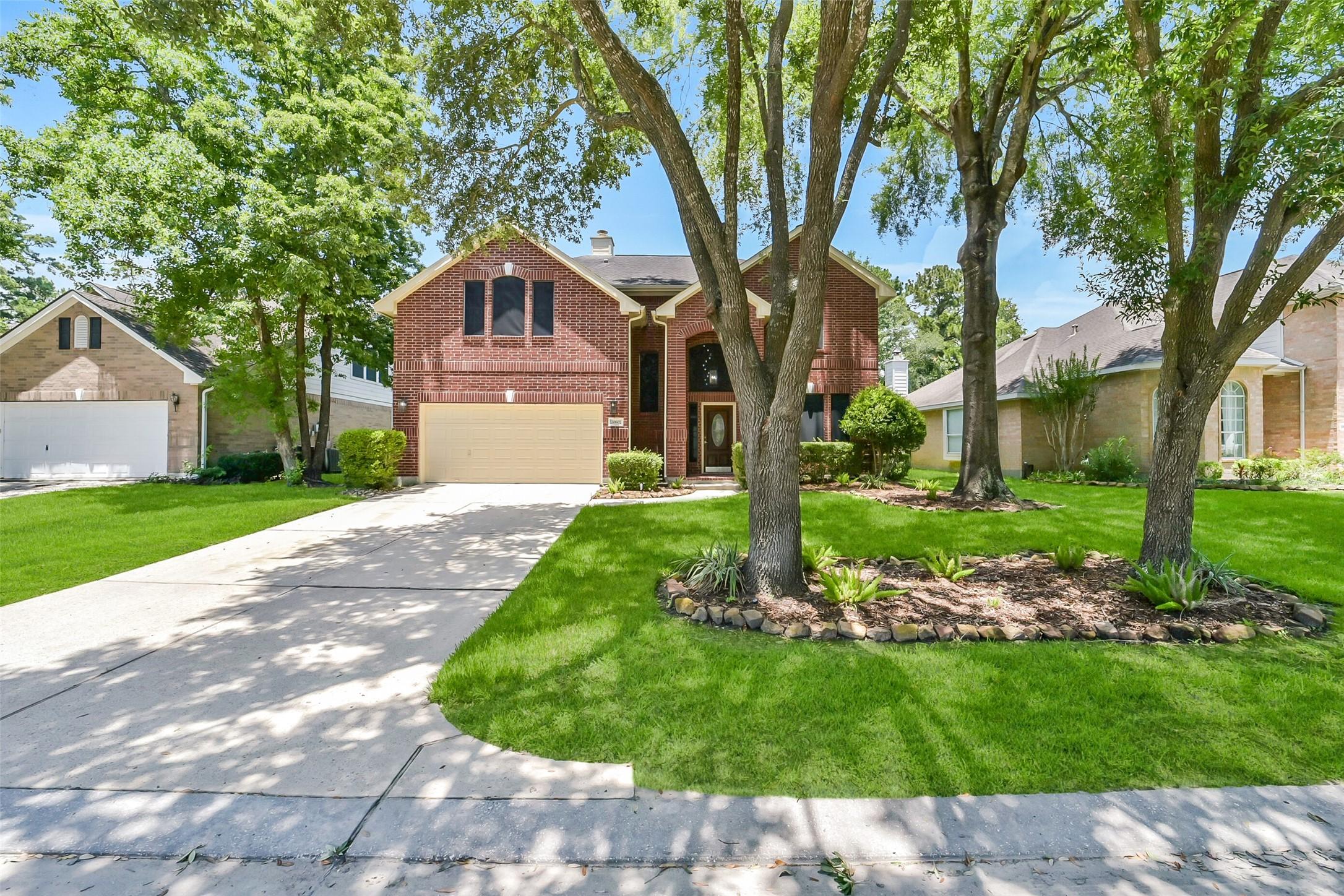 Image 2: Mature trees shade this home with a THREE car tand
