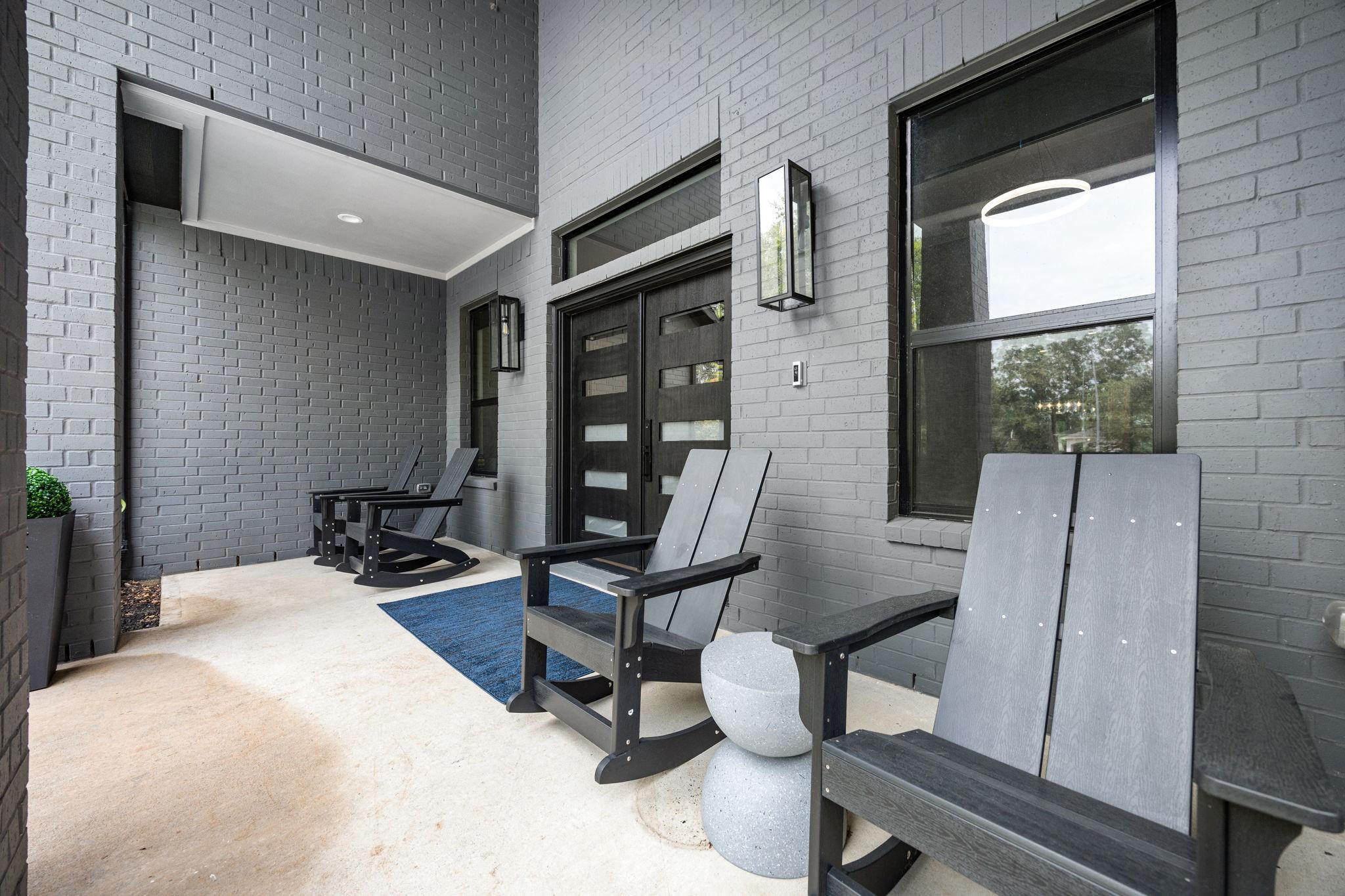 Image 3: This photo showcases a modern front porch with sle