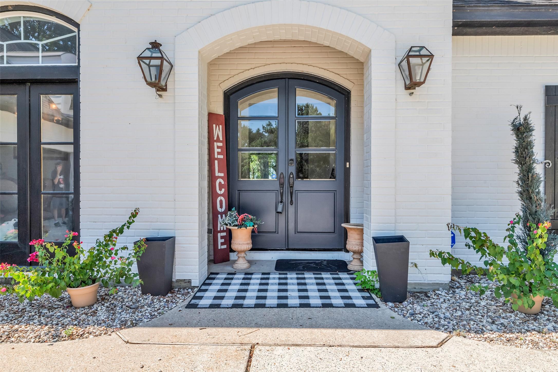 Image 4: Charming entryway with a double-door entrance fram