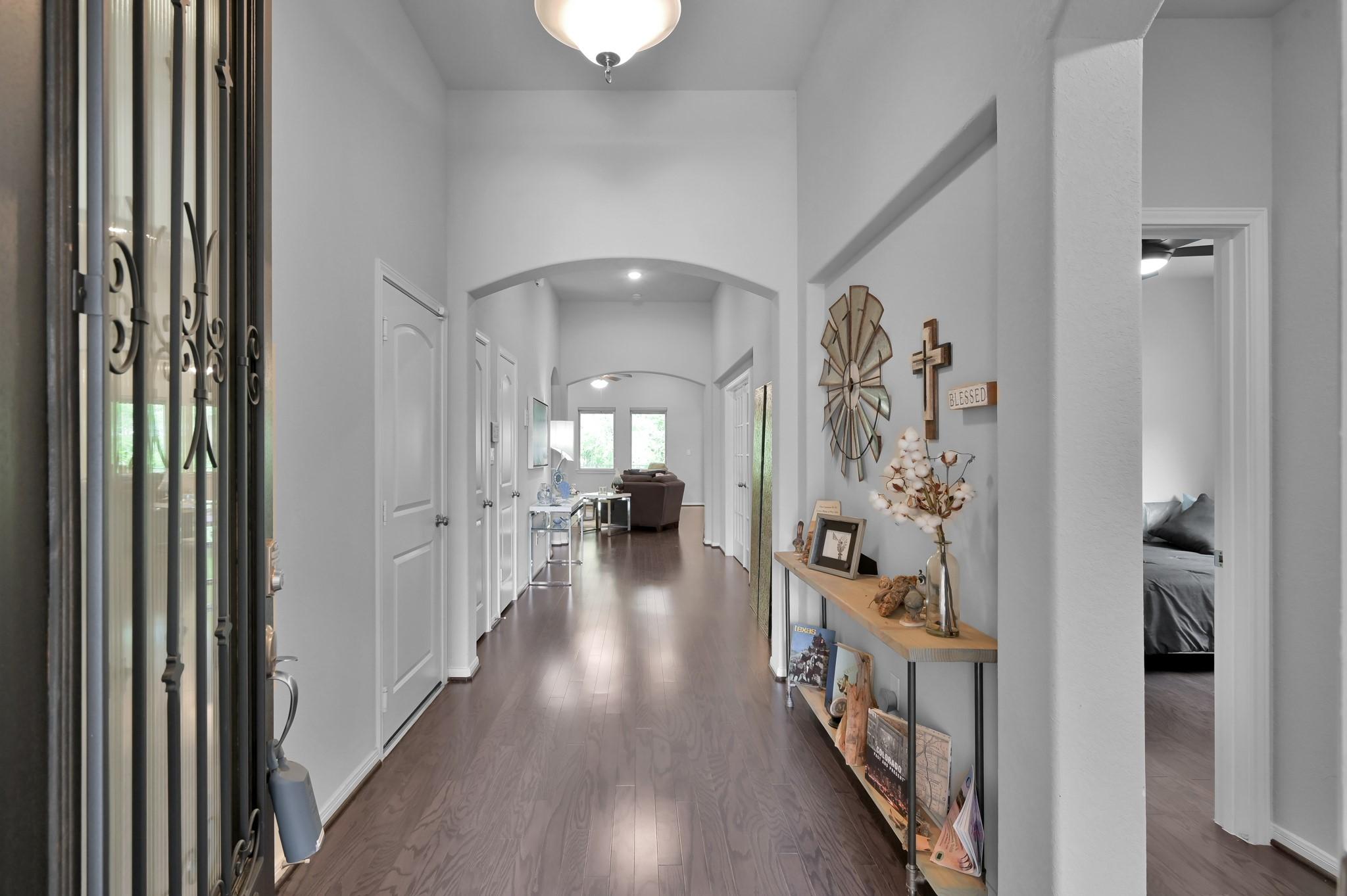 Image 1: This photo showcases a bright, inviting hallway wi