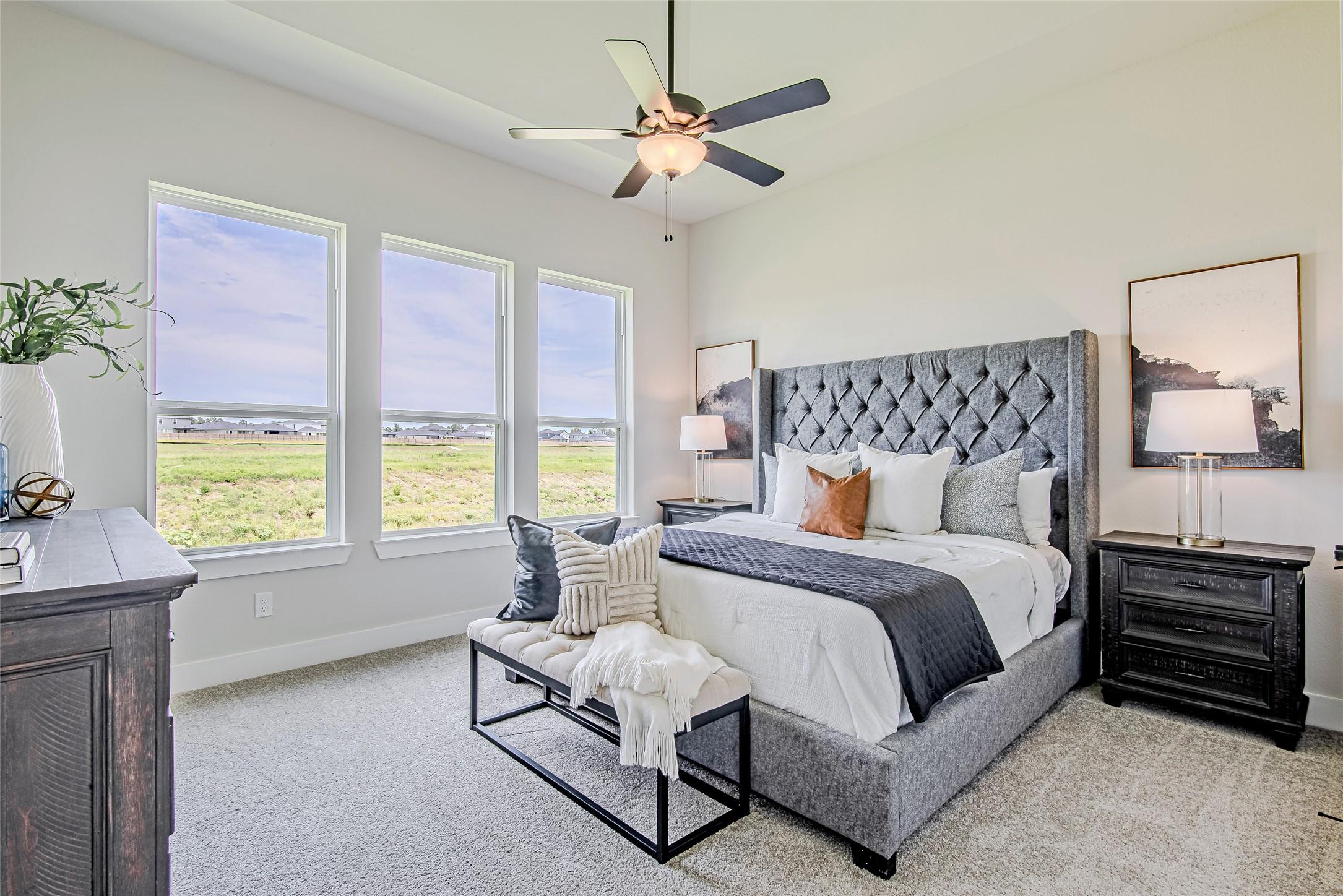 Image 4: Retreat to a spacious primary suite with ample nat