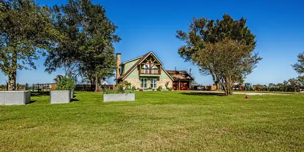 Image 2: Situated atop the hill with panoramic lake views,
