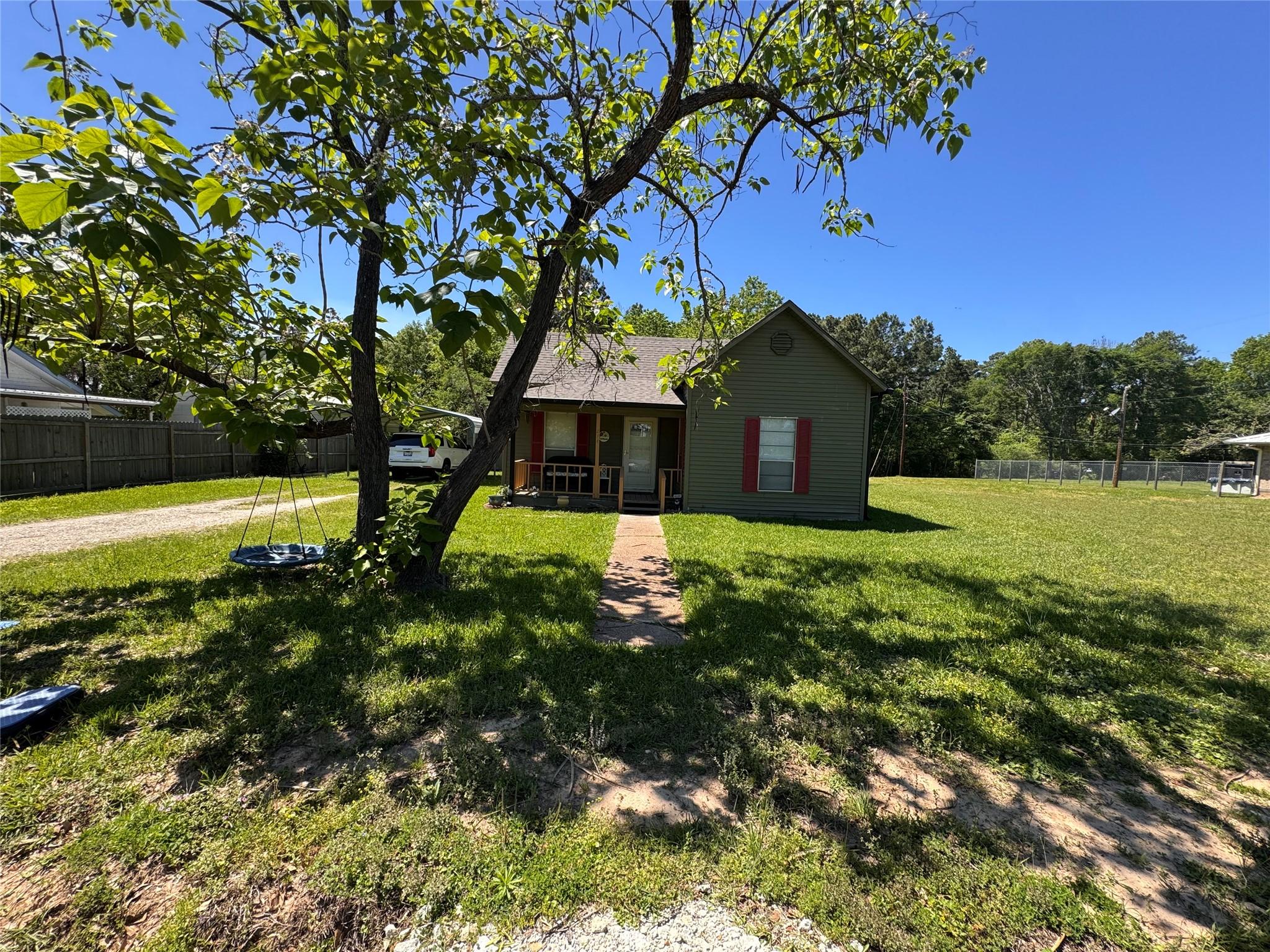 Image 2: Charming single-story home with a welcoming porch,