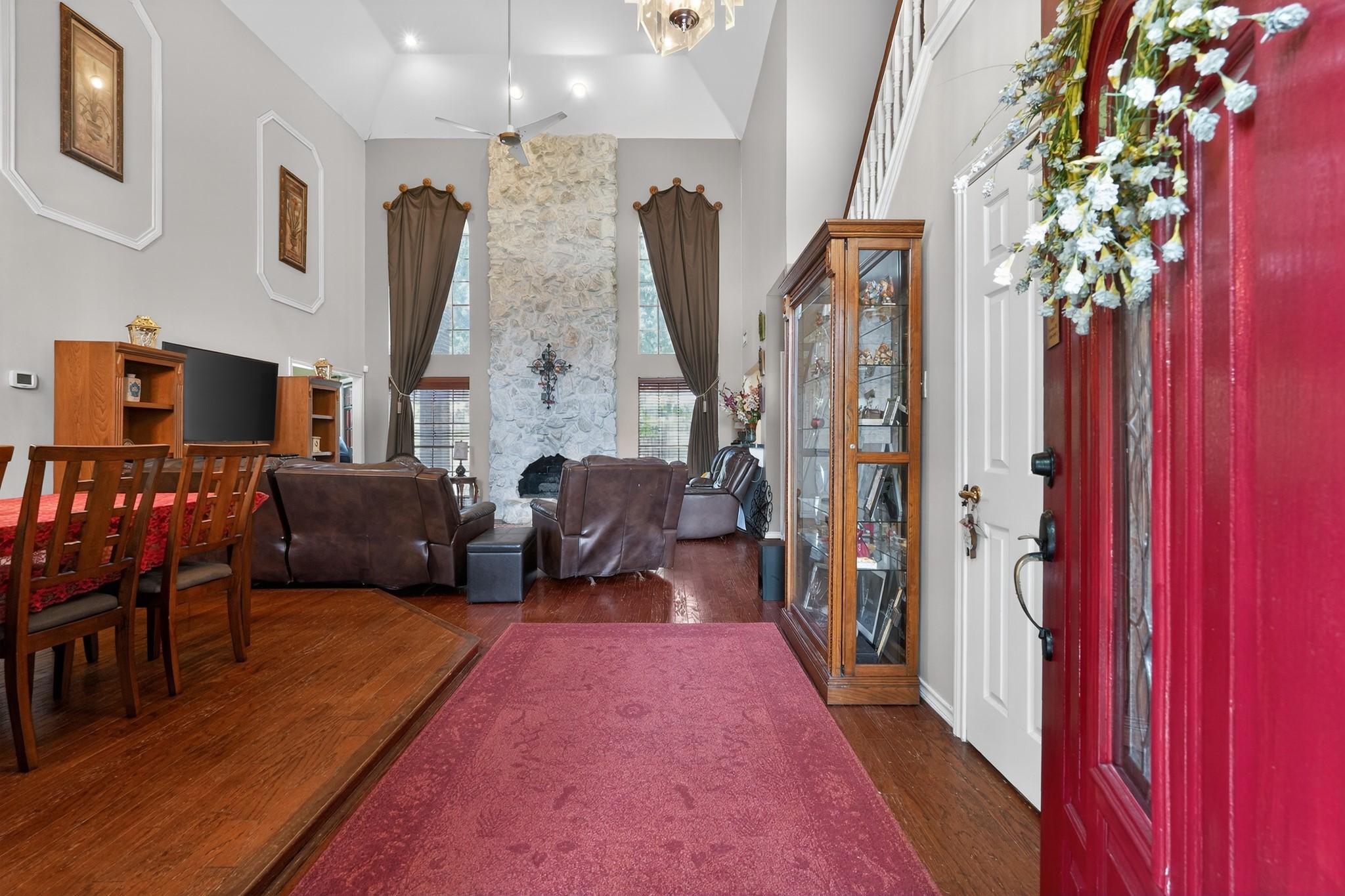 Image 3: Entry way open to living room and dining room