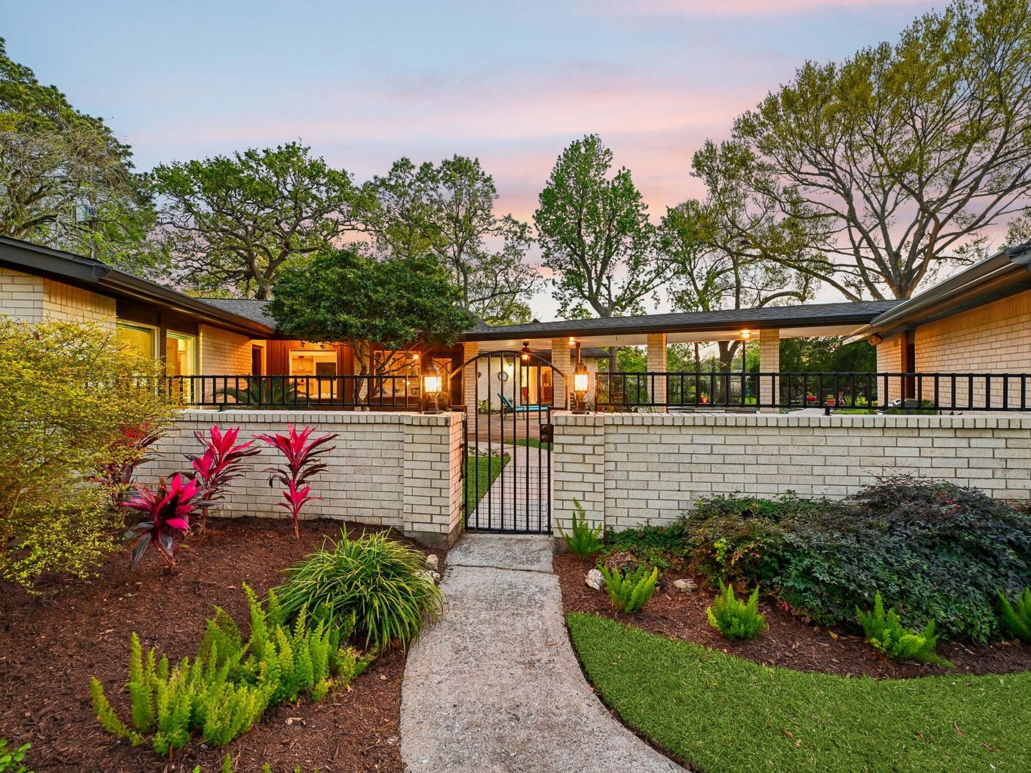 Image 3: Fresh and stunning landscaping will beckon you.