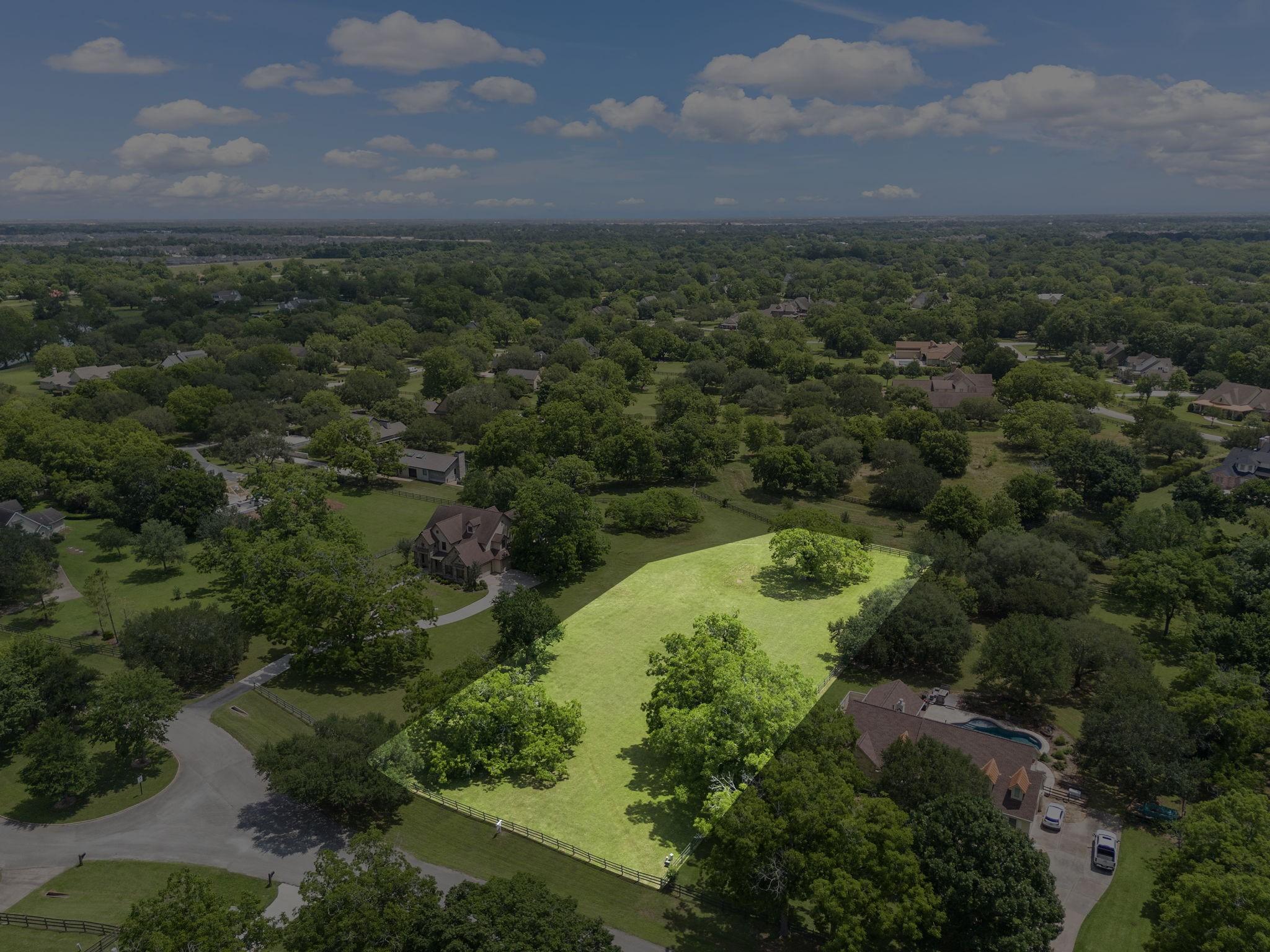Image 1: This photo showcases a spacious, lush green plot i