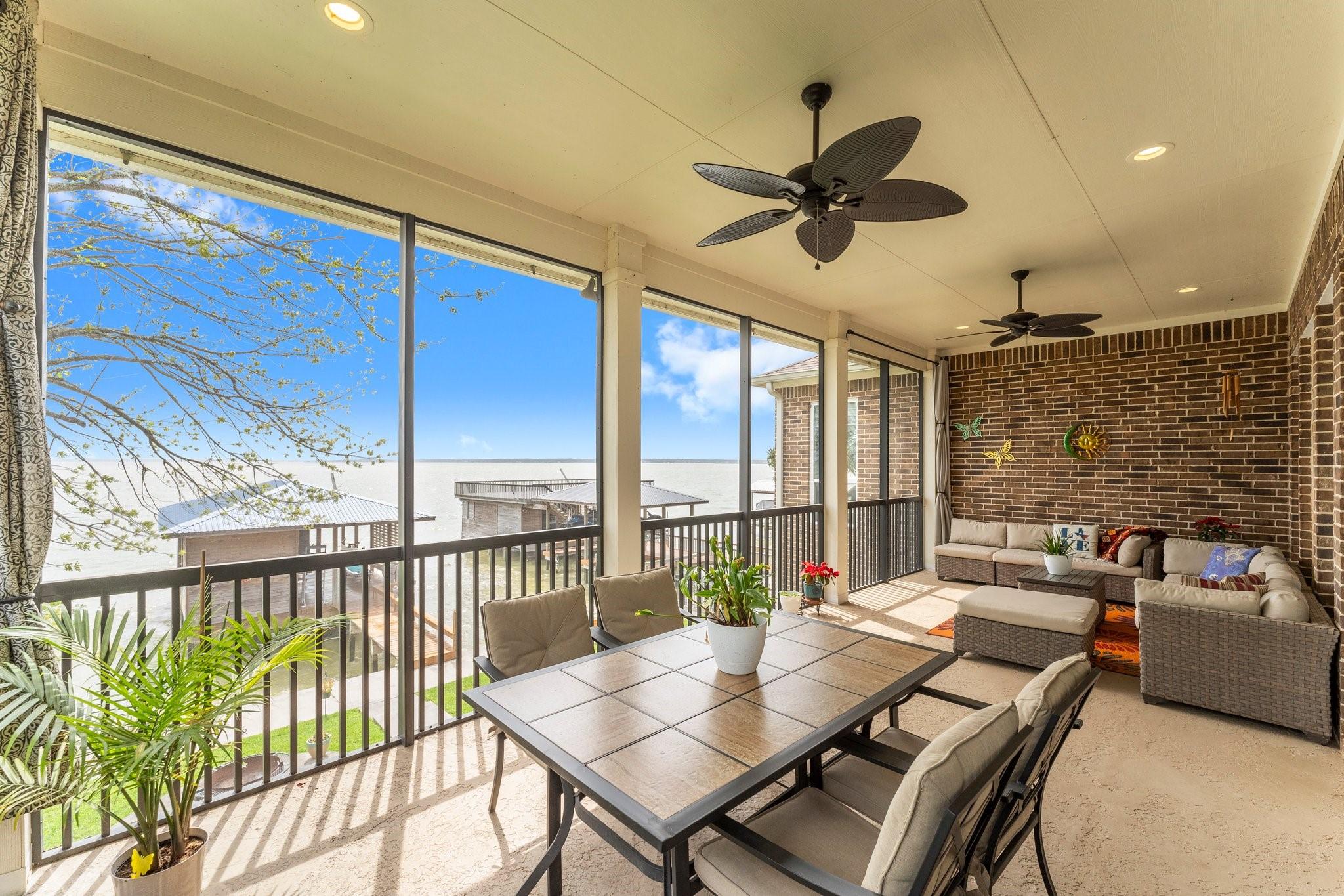 Image 1: Main level screened porch with plenty of room for