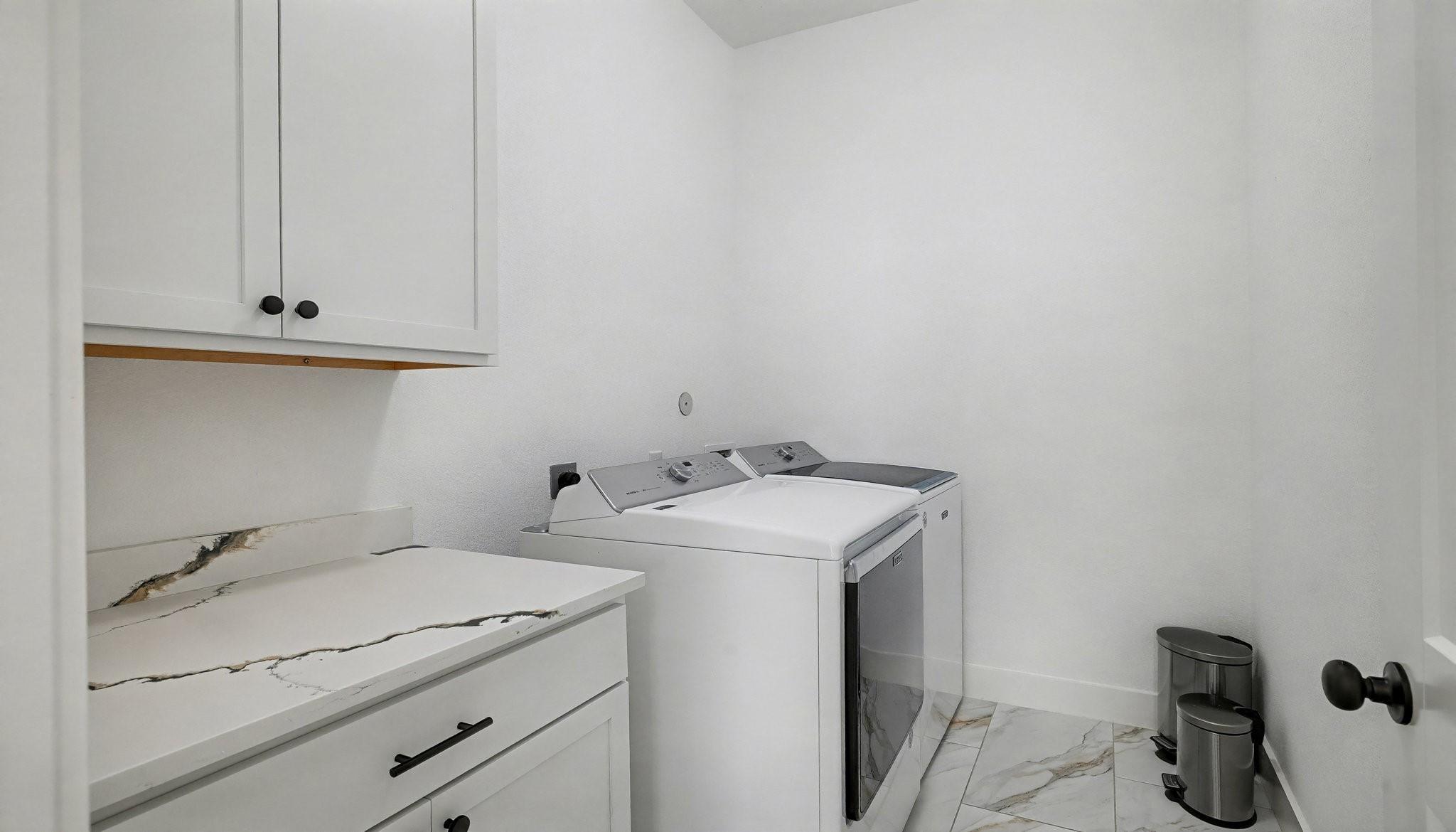 Image 4: Spacious Laundry with ample storage