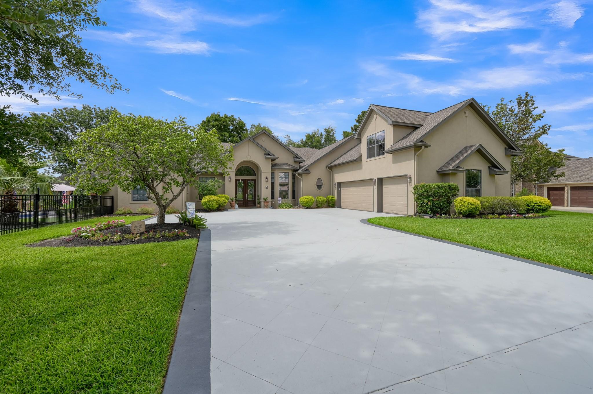 Image 2: GRAND ARRIVAL &ndash;
A sweeping driveway, lush landsca