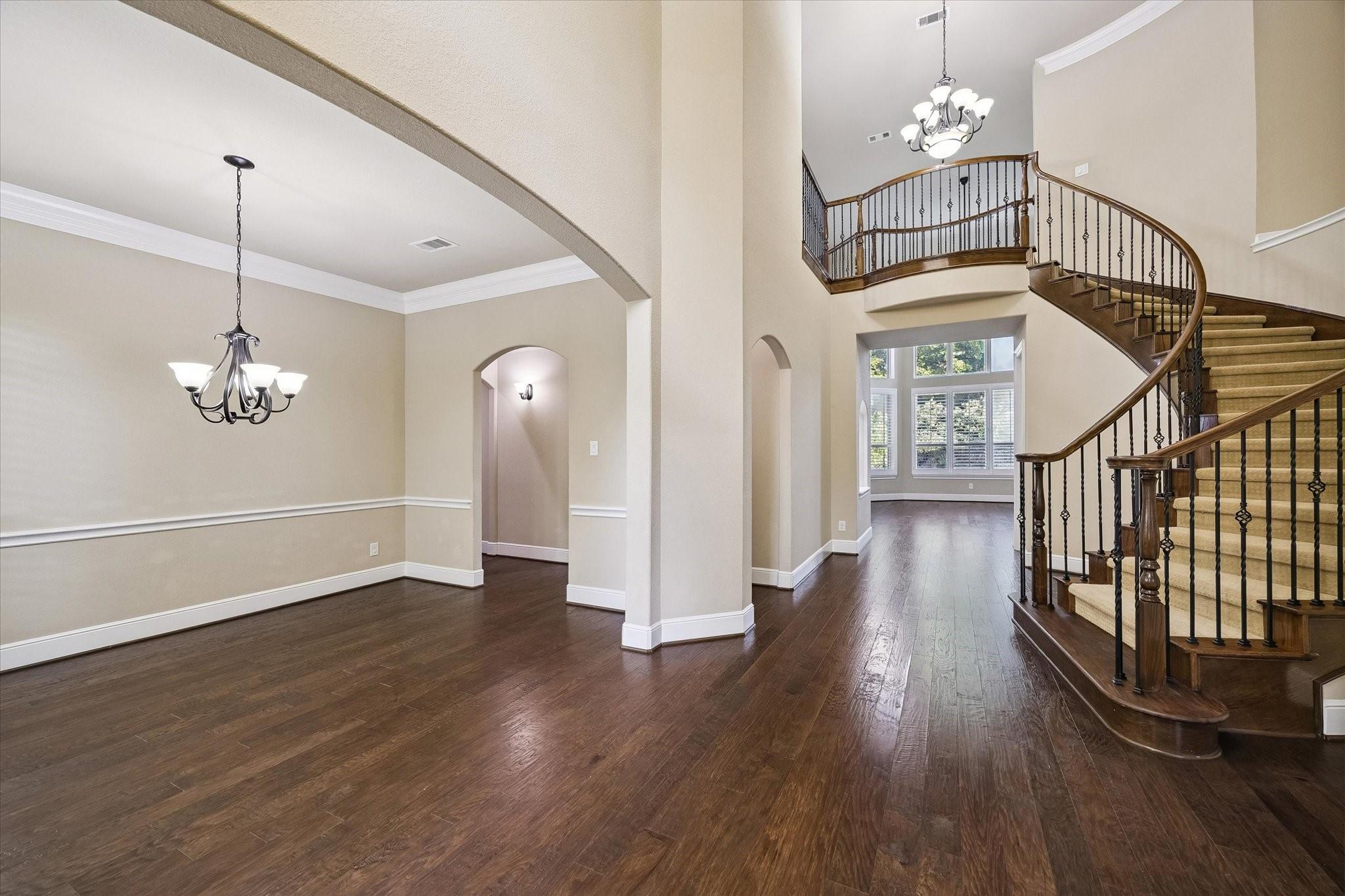 Image 4: The home's impressive foyer welcomes guests with s