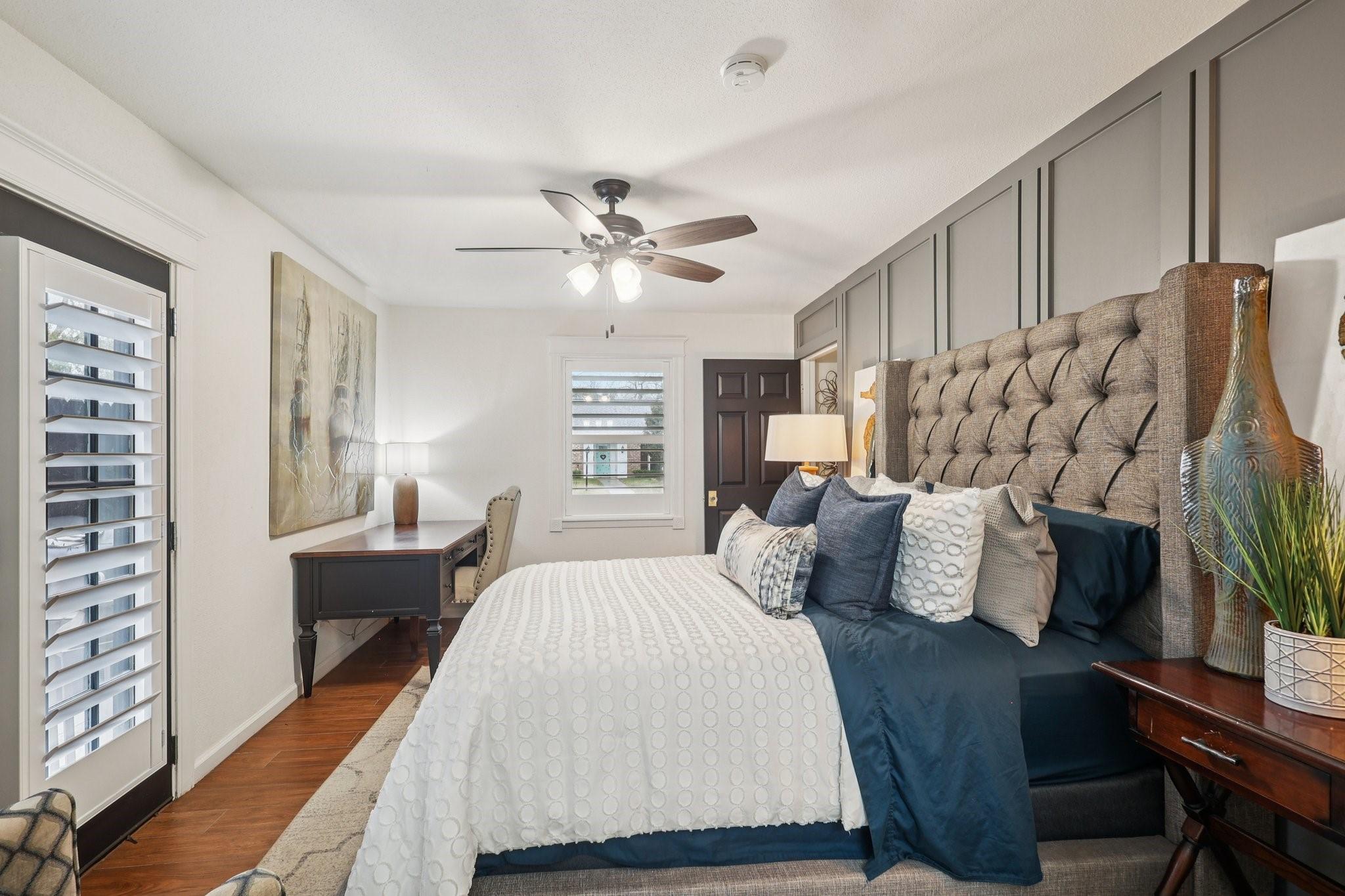 Image 2: Bedroom 2 with access to the back patio and en-sui