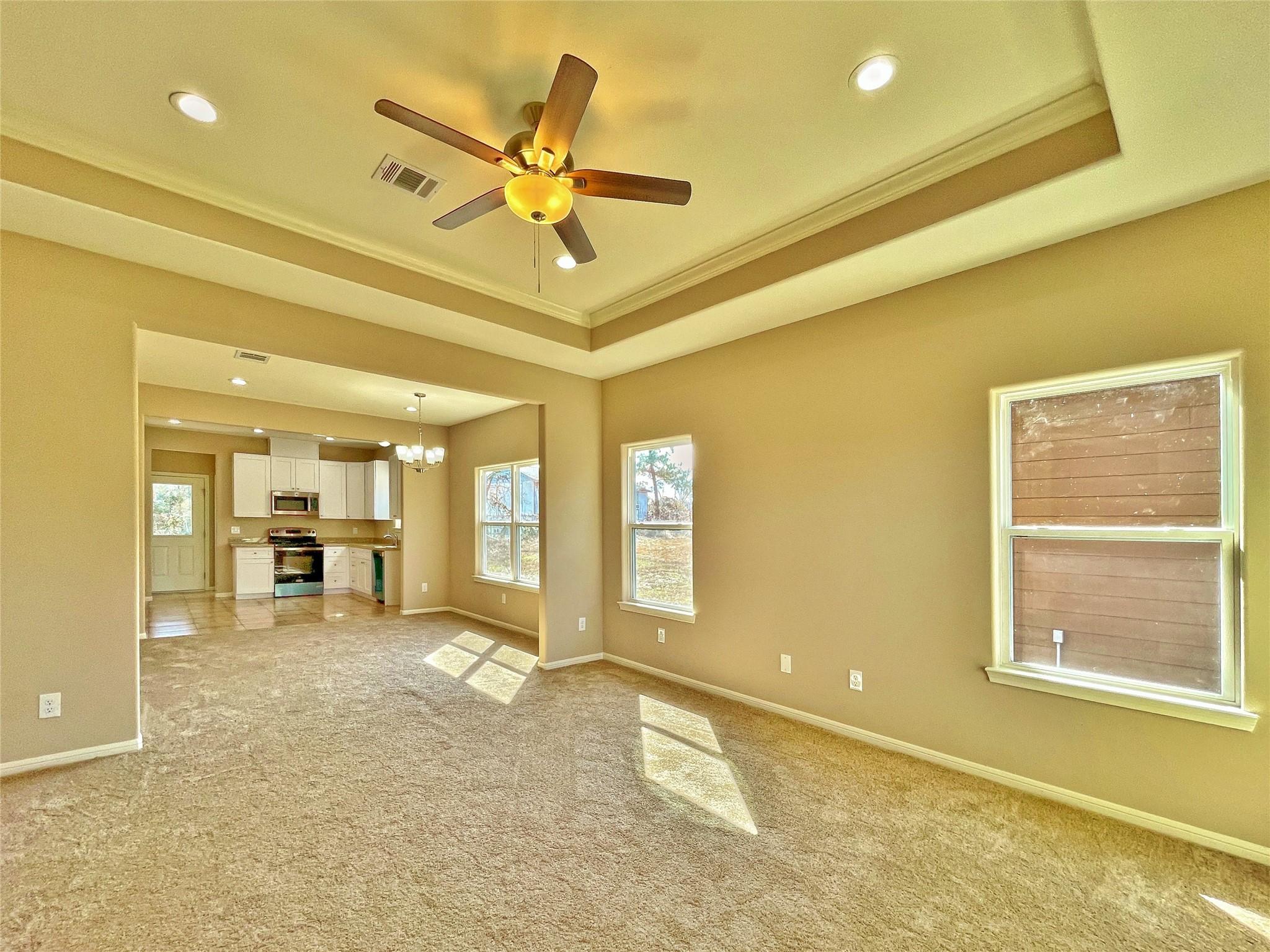 Image 2: As you enter the home you are greeted by the livin