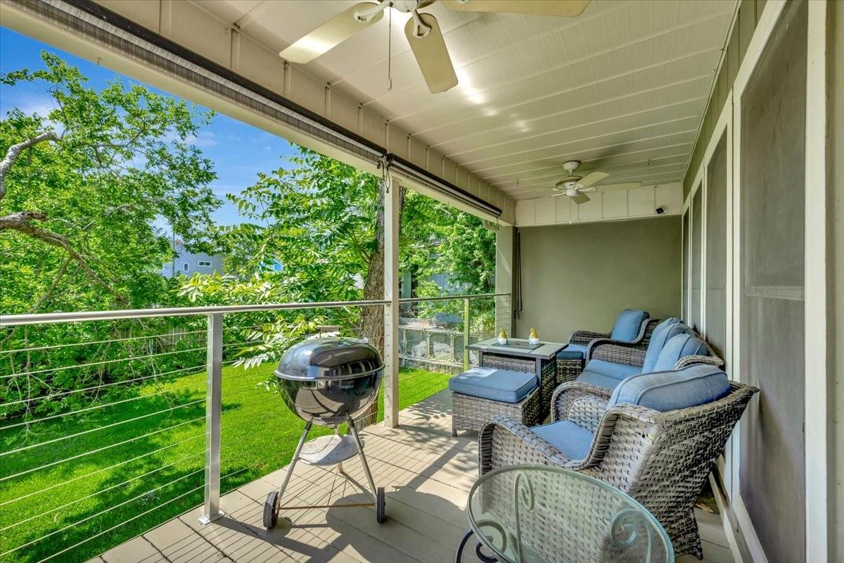 Image 3: REAR BALCONY OVERLOOKING THE TREE COVERED BACKYARD