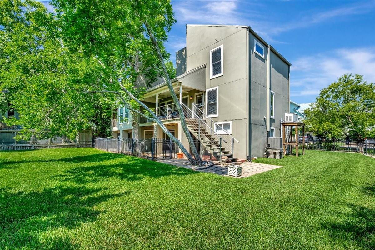 Image 4: VIEW OF THE OVERSIZED, FULLY FENCED YARD, CONSISTI