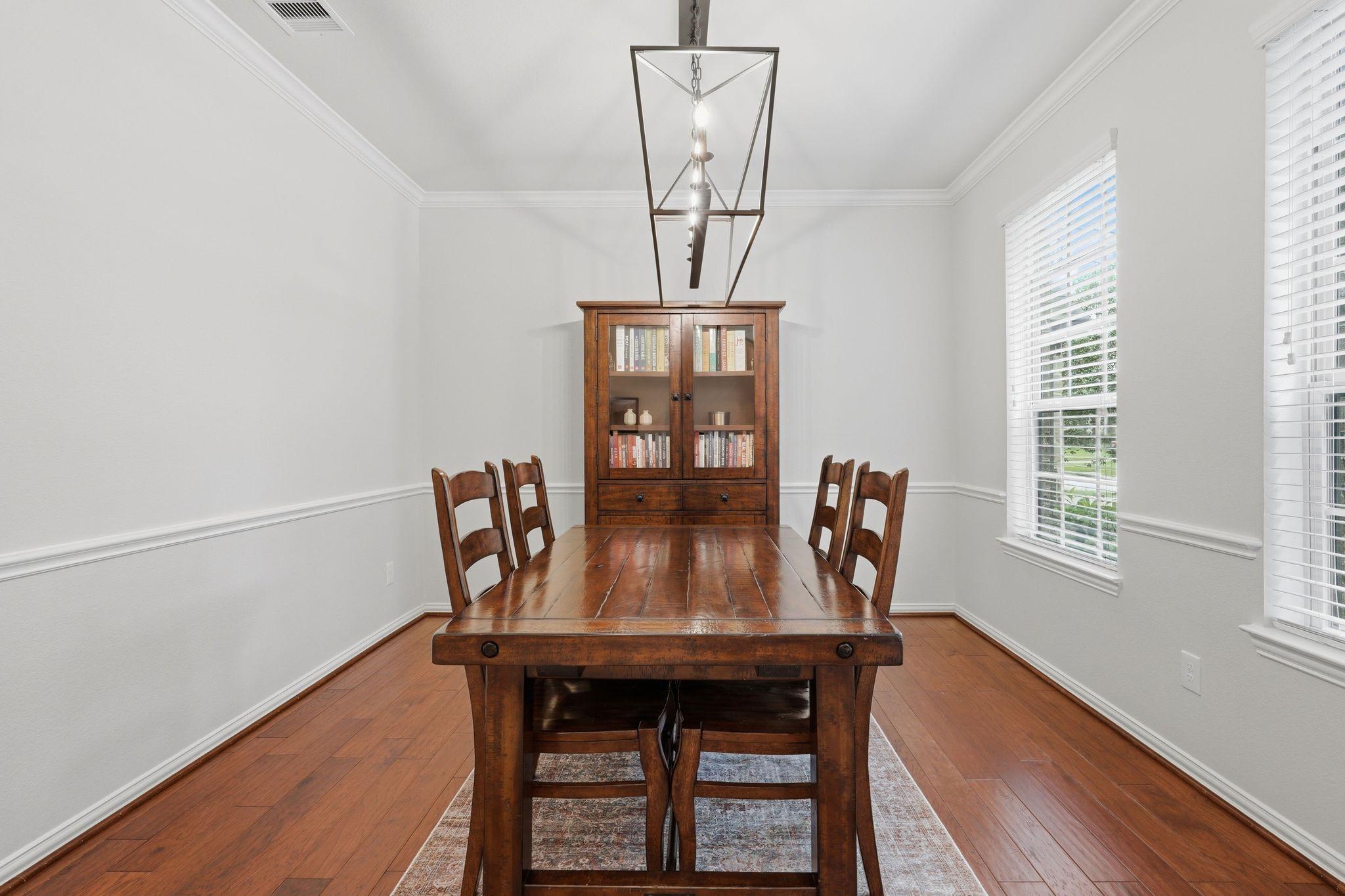 Image 4: Formal dining in the front of the home with beauti