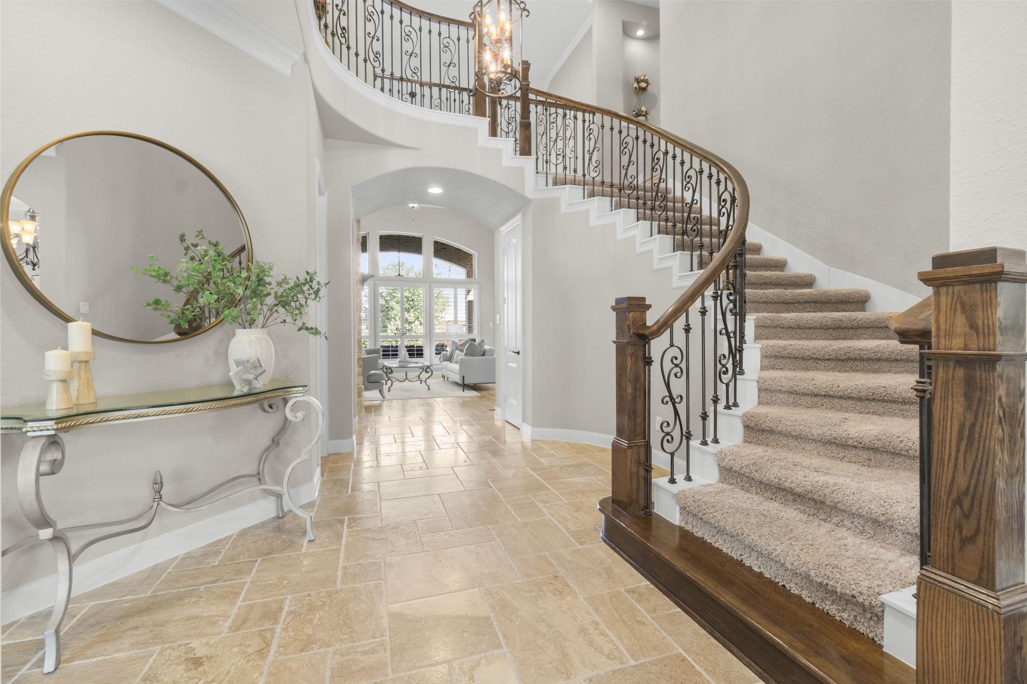 Image 3: Grand Two Story Entrance With Sweeping Staircase