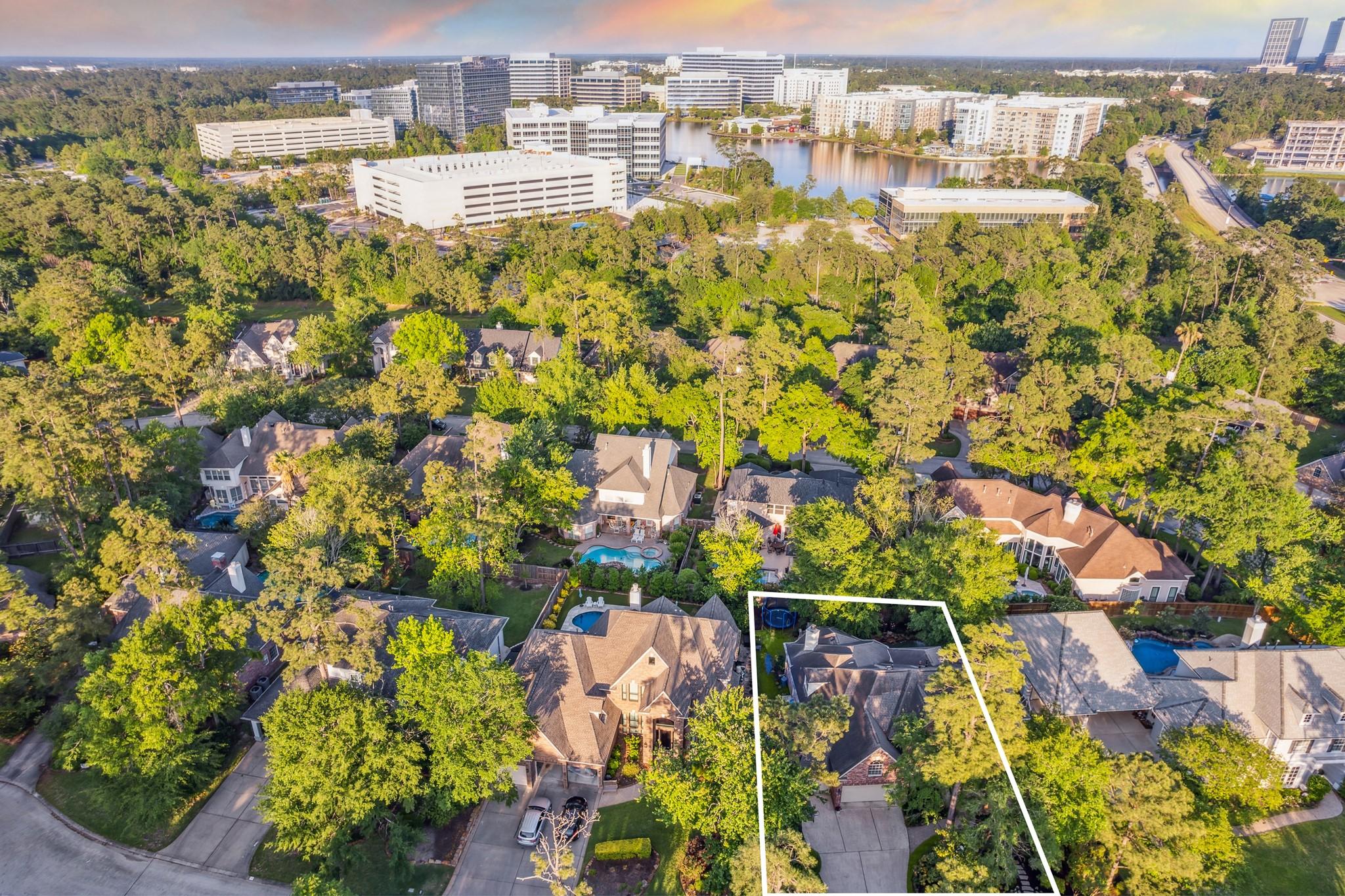 Image 4: Nestled among mature trees in a private oasis with