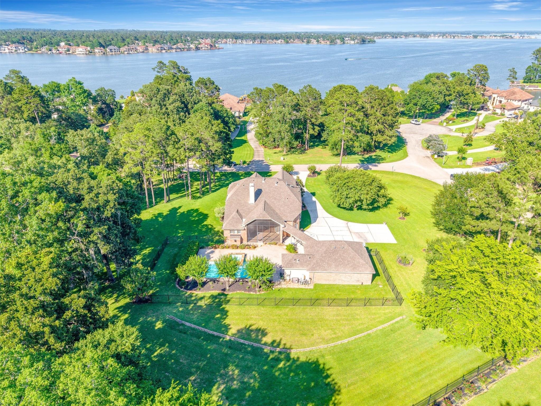 Image 3: This aerial shot highlights the backyard oasis, sh
