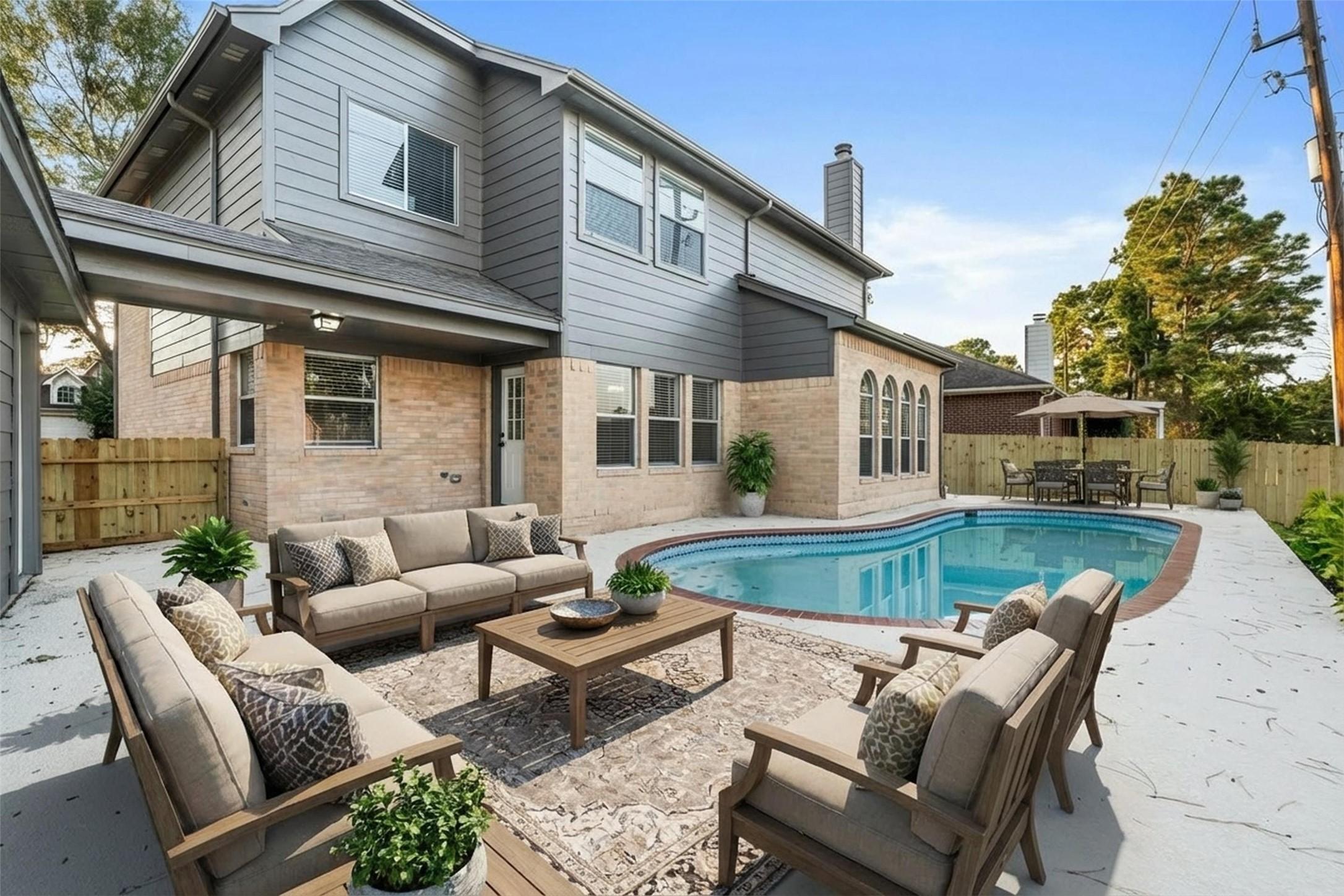 Image 2: Private backyard retreat featuring a resurfaced po