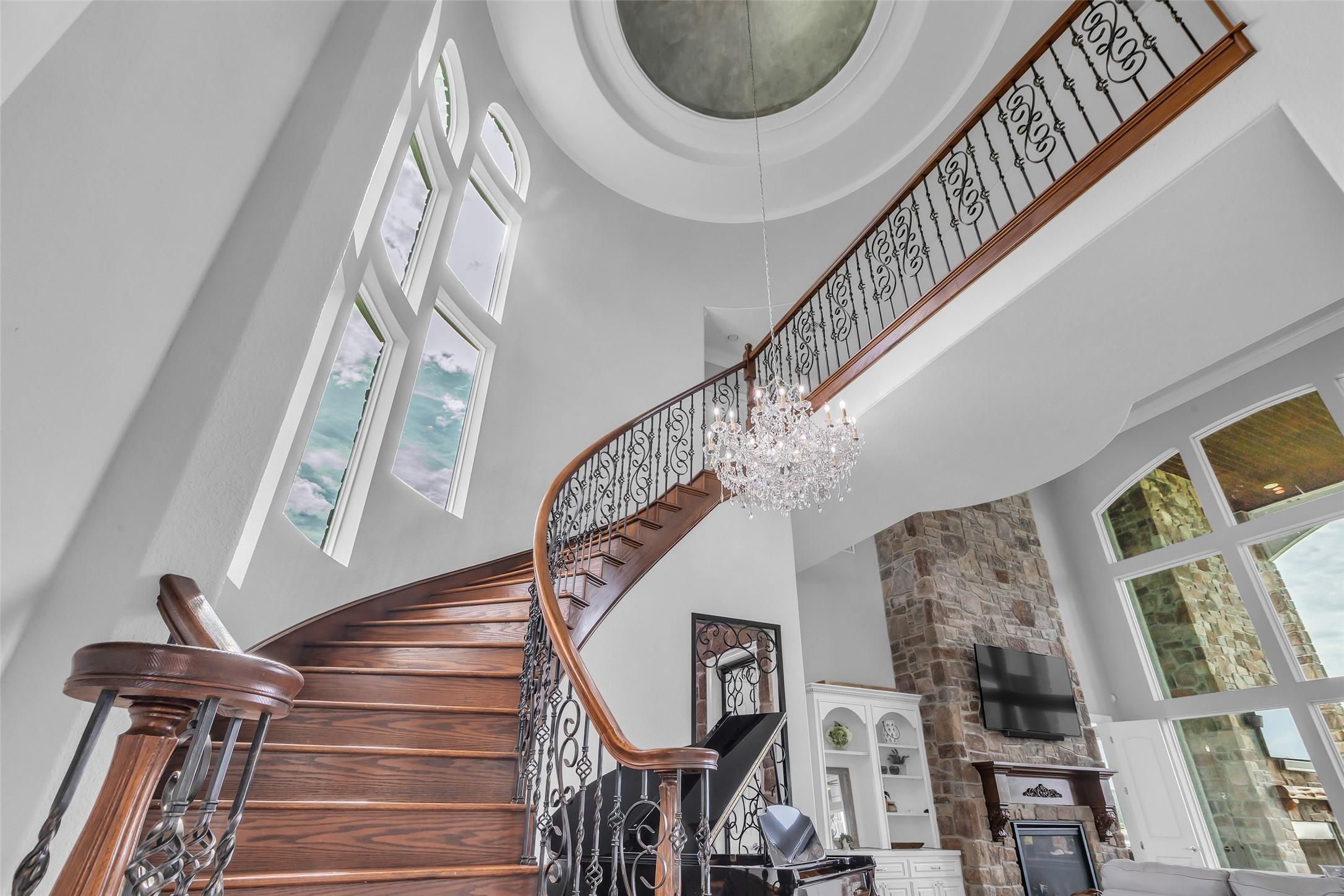 Image 4: This photo showcases an elegant, curved staircase