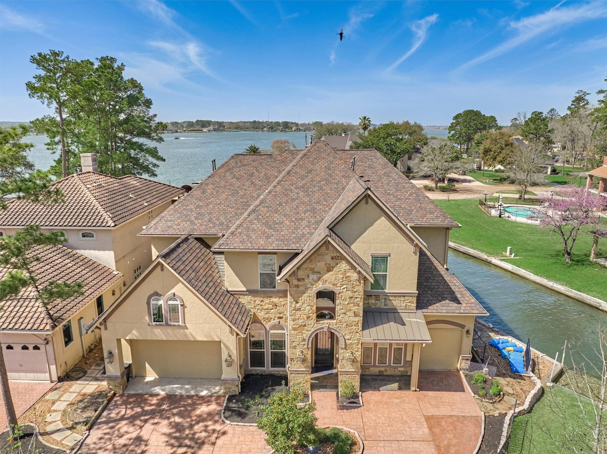 Image 2: This home sits on a protected cove, just seconds t