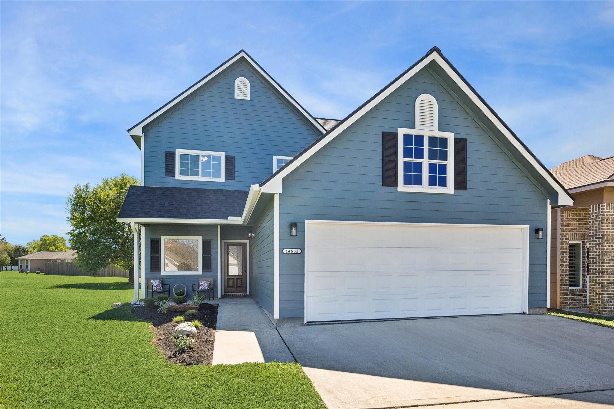 Image 2: A shaded front porch greets you and an inviting wa