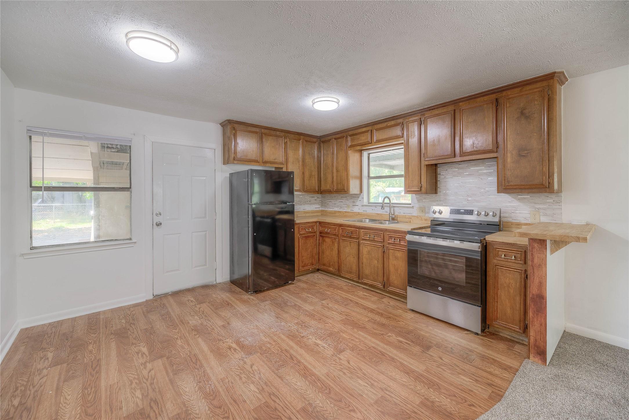 Image 2: OPEN CONCEPT HOME, KITCHEN HAS LOTS OF CABINET AND