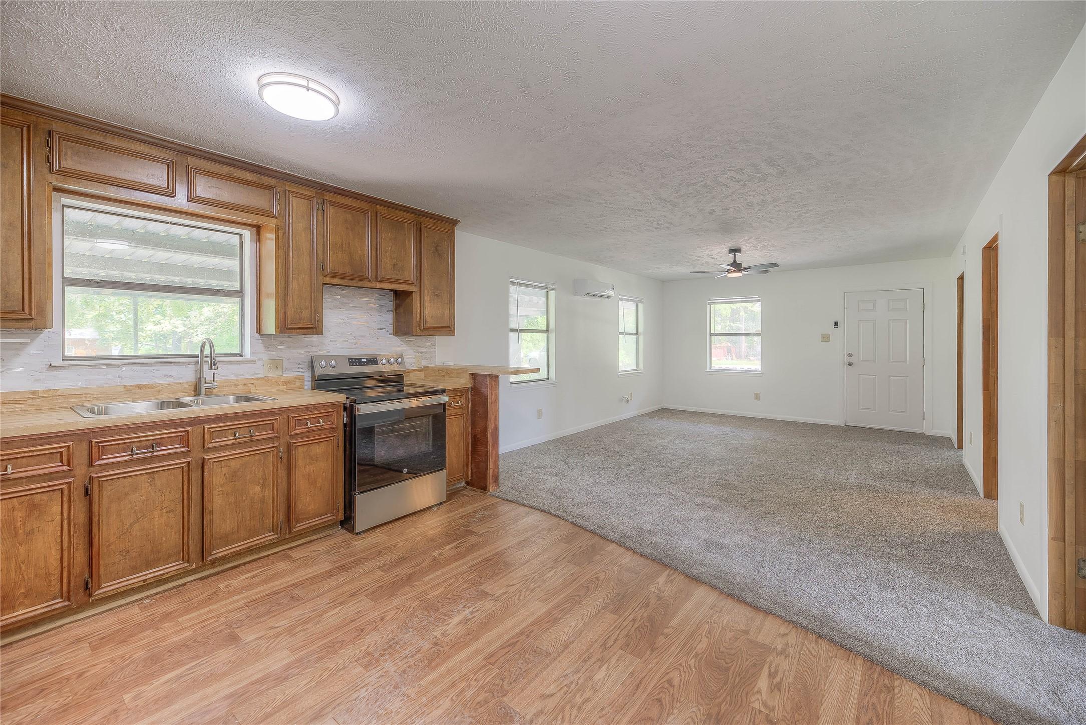 Image 3: OPEN CONCEPT HOME. NEW CARPET IN LIVING AREA