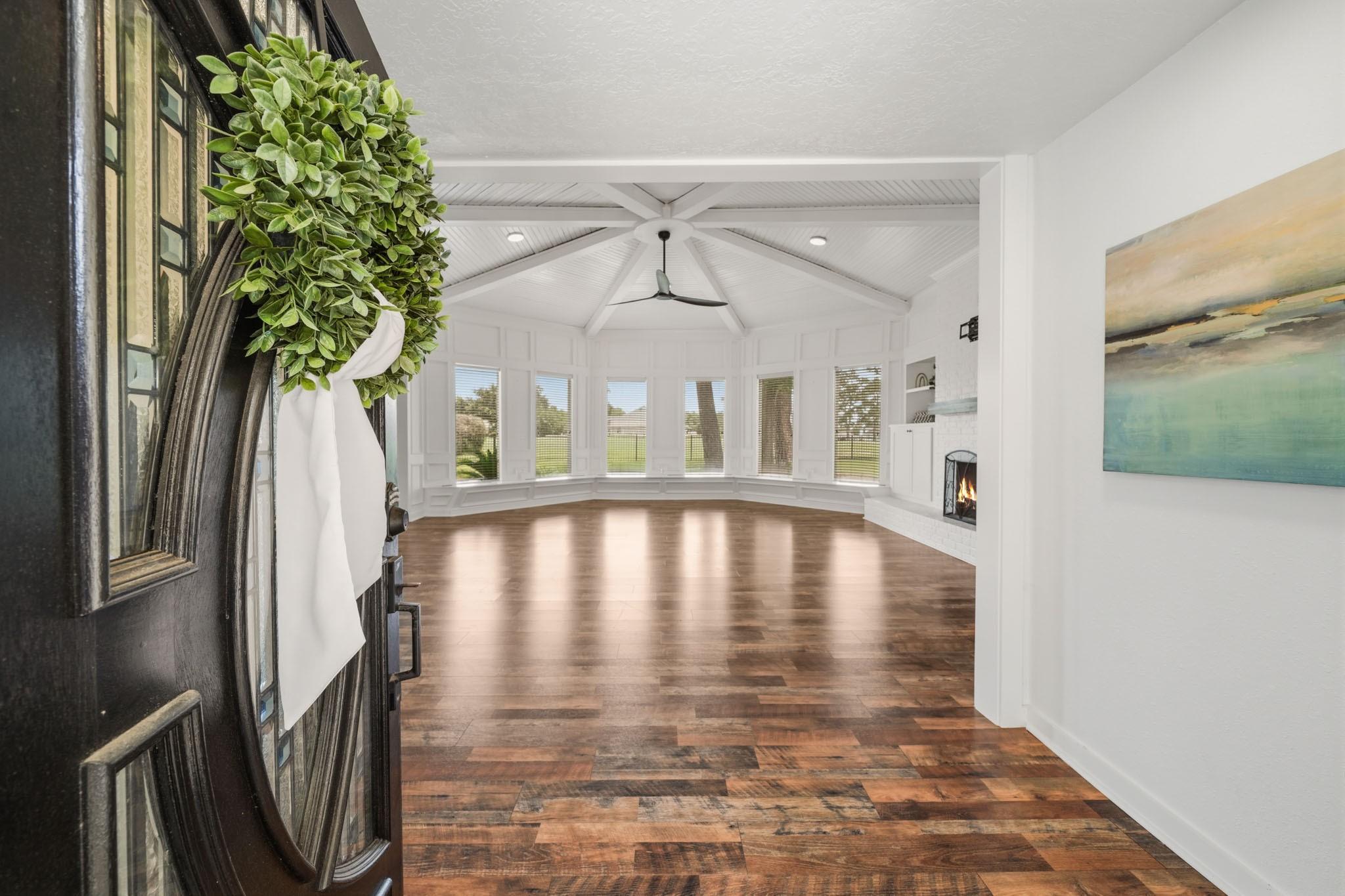 Image 3: The inviting entry sets the tone for the home, sho