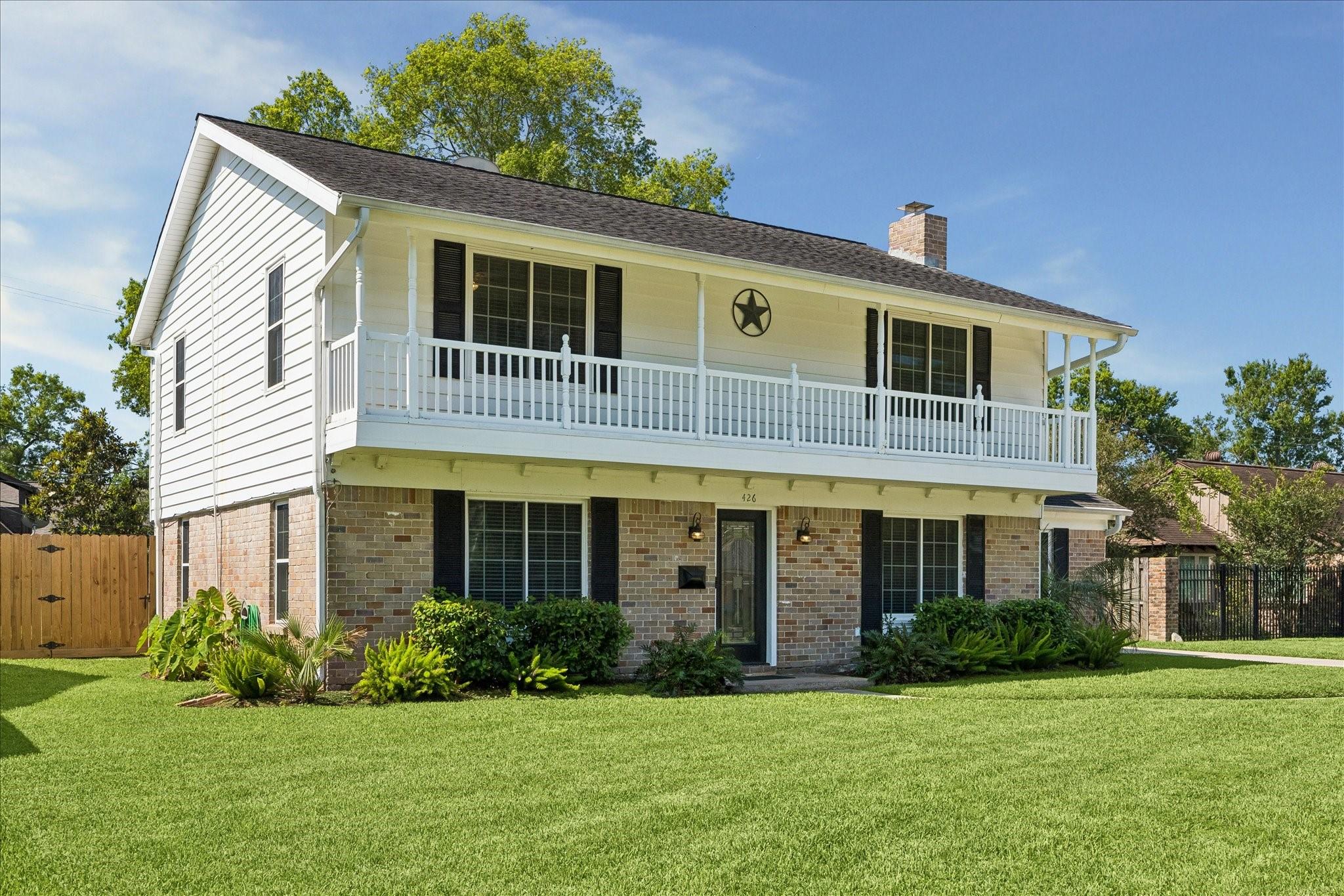 Image 2: Lots of green space in the front and back yard.