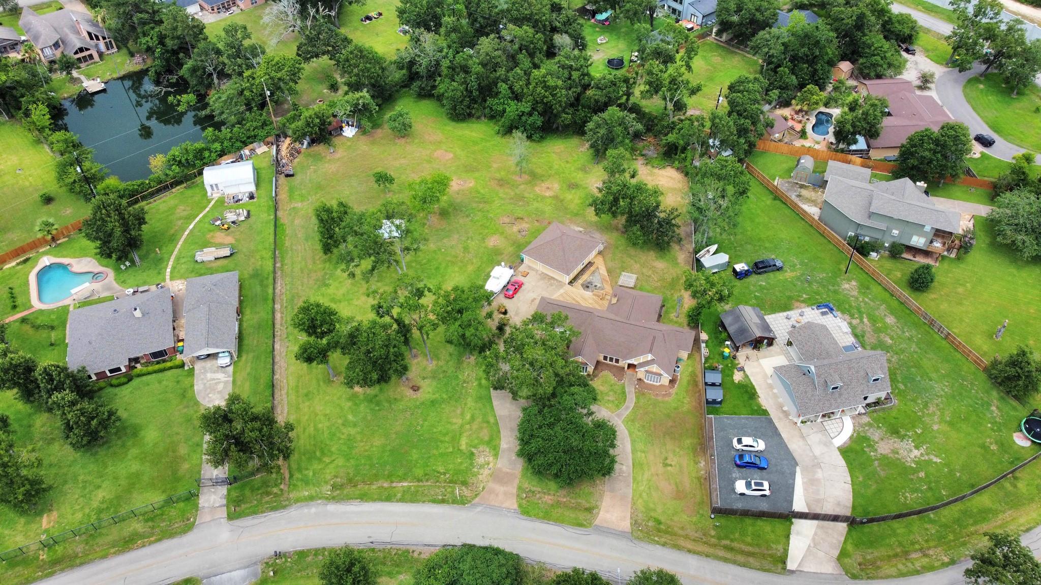 Image 2: This aerial photo shows a spacious property with a