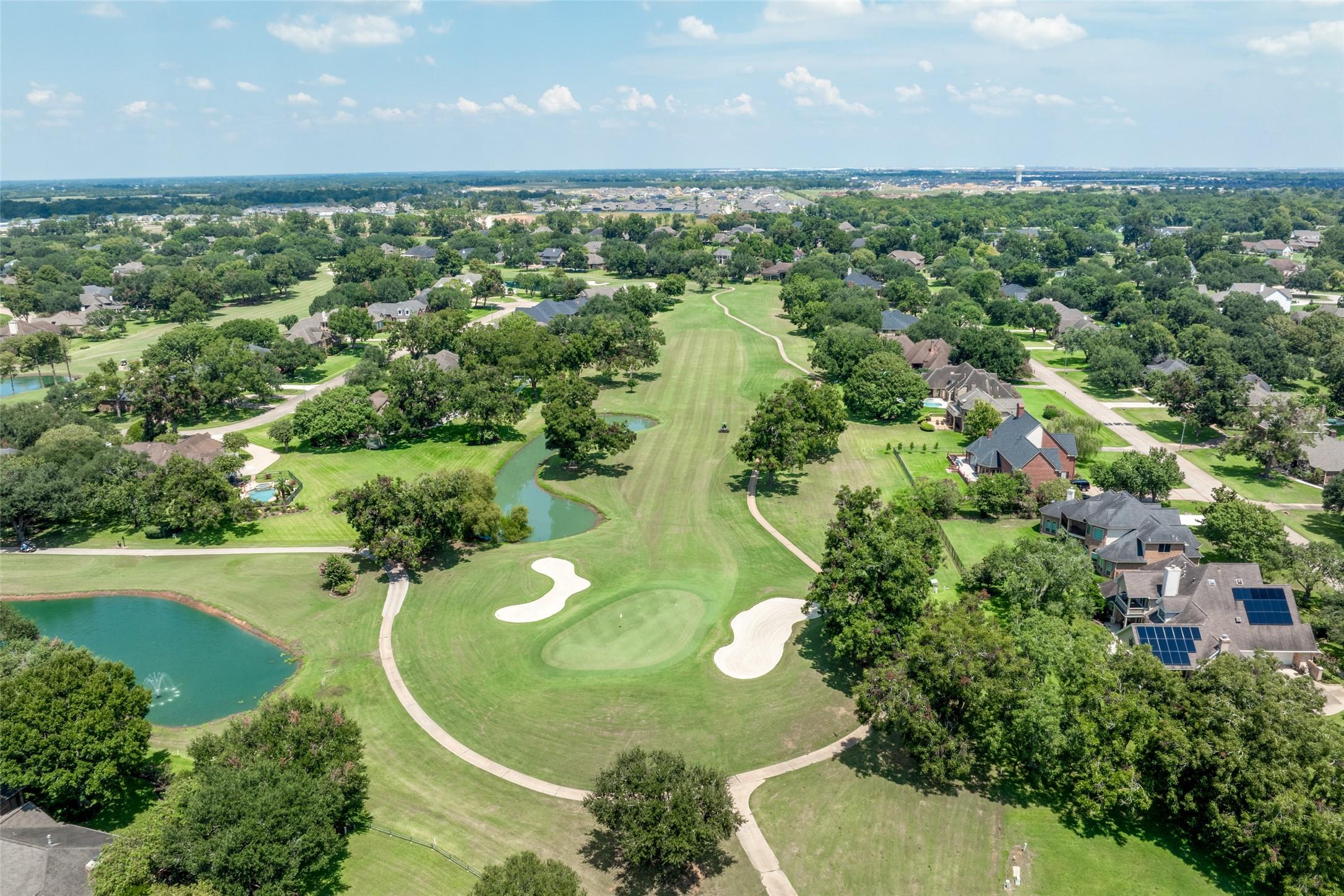 Image 3: Aerial perspective looking down the 4th hole and n
